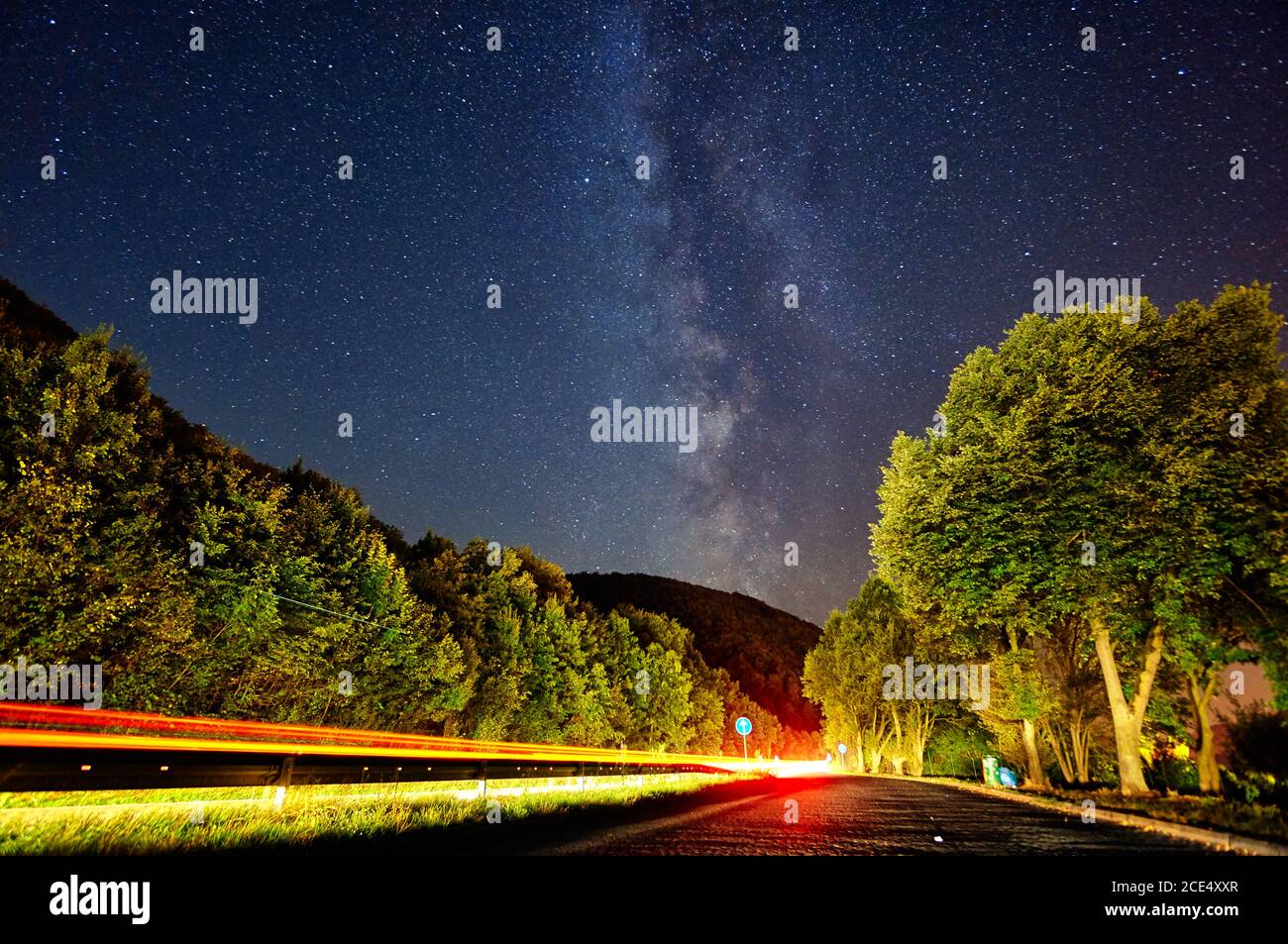 Milky Way galaxy on the side of the highway near Ulm with car trails Stock Photo
