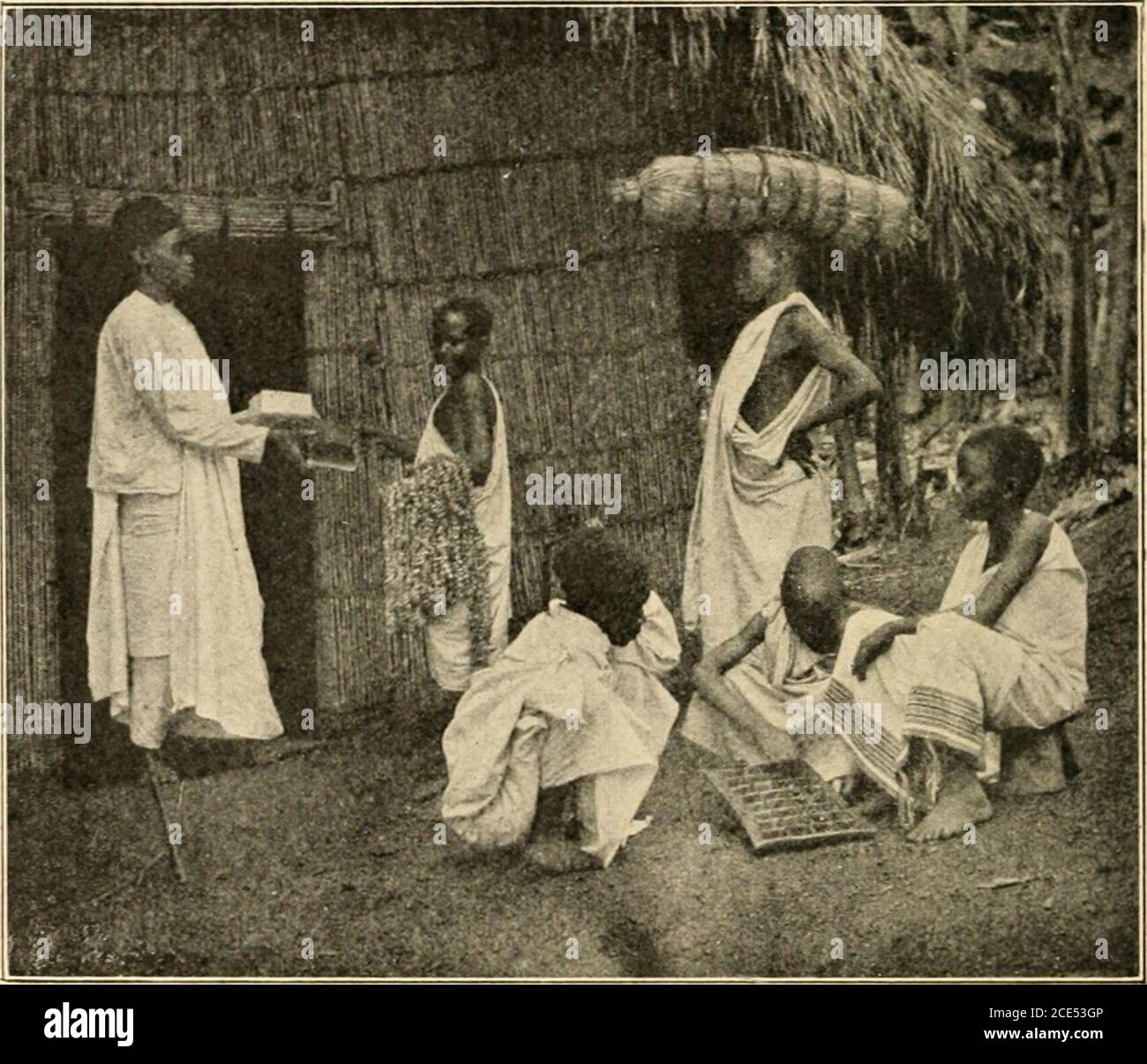 The Baganda . FIG. 17.—BAGANDA BOYS WRESTLING. games. Their chief game was  the throwing of a stick(kubariga); the stick was fairly stout, and about  eighteeninches long; each boy was armed with