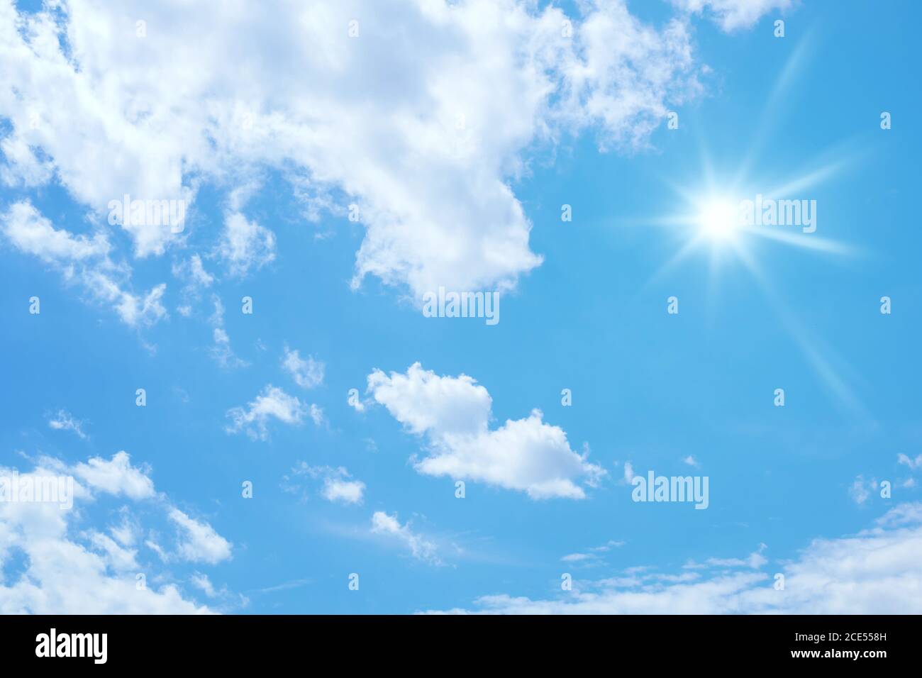 blue sky with sun and clouds background Stock Photo