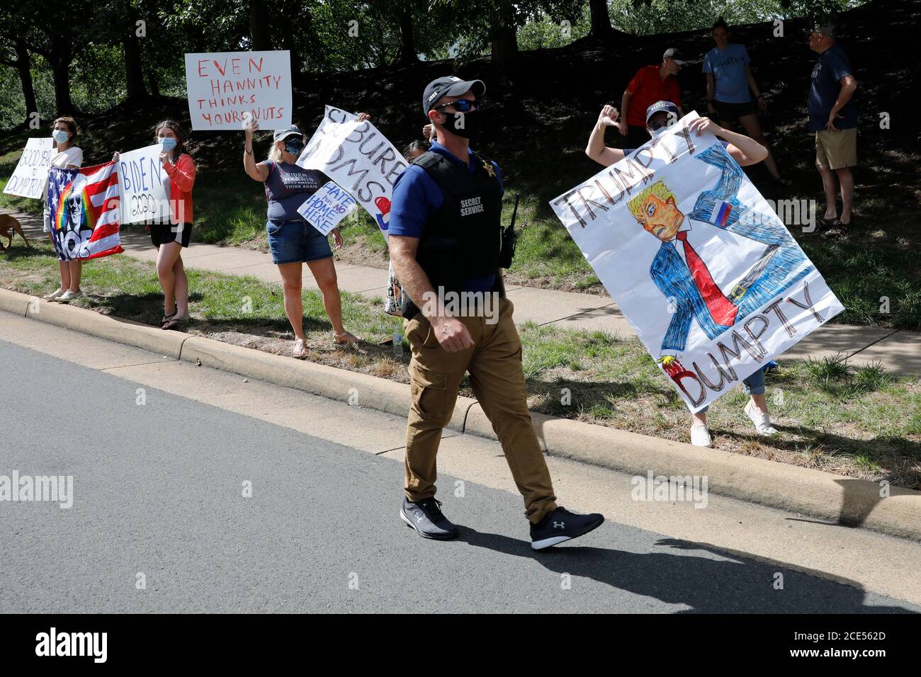 Protesters react outside Trump National Golf Club as U.S. President Donald Trump's motorcade passes by in Sterling, Virginia on August 30, 2020. Credit: Yuri Gripas/Pool via CNP/MediaPunch Stock Photo