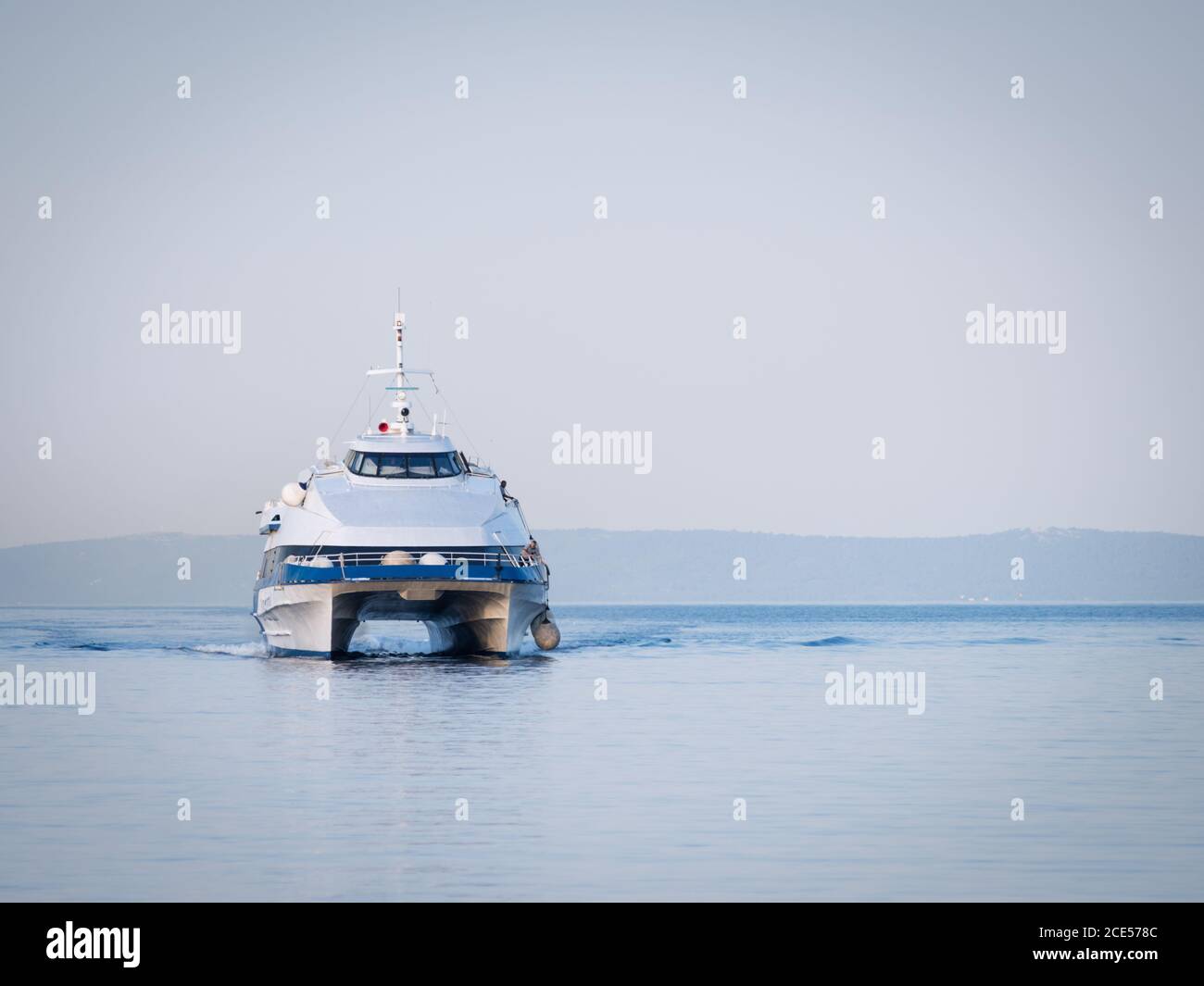 Catamaran ferry boat arrives at rab in croatia Stock Photo