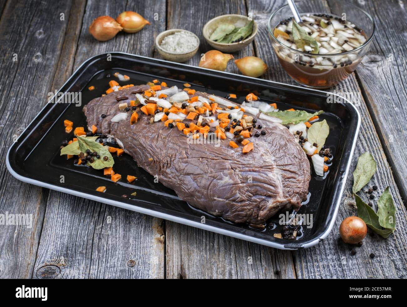 Marinated traditional German Sauerbraten from beef with vegetable and
