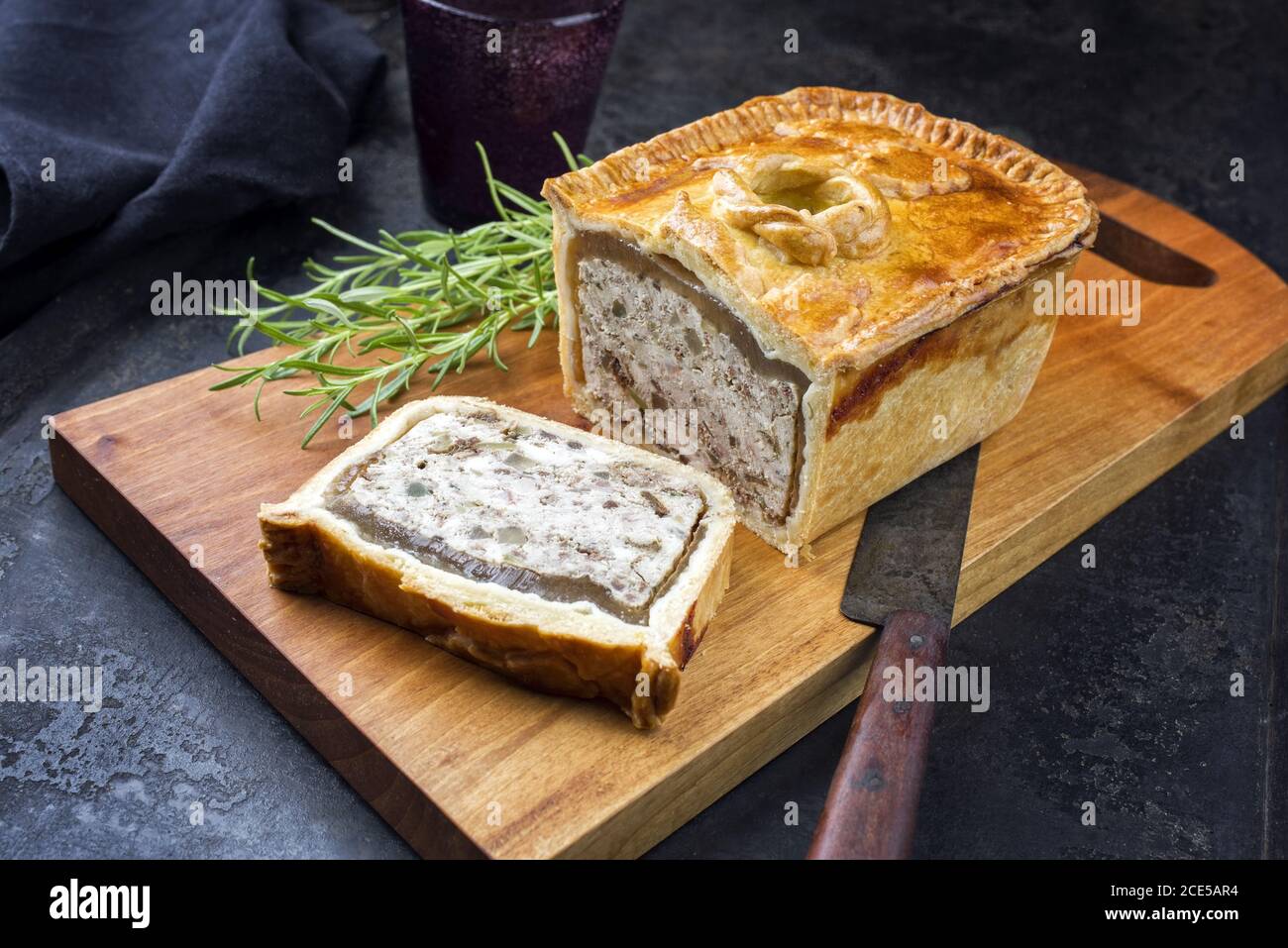 Traditional French Pate en croute with chicken offered as closeup on a