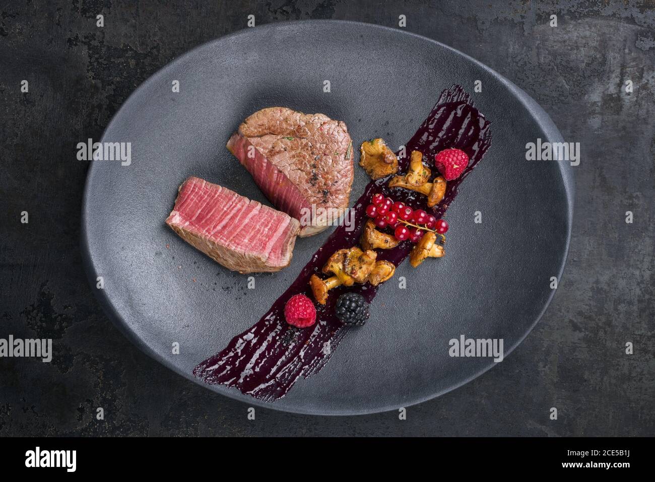 Fried dry aged beef fillet chateaubriand medallion steak natural with