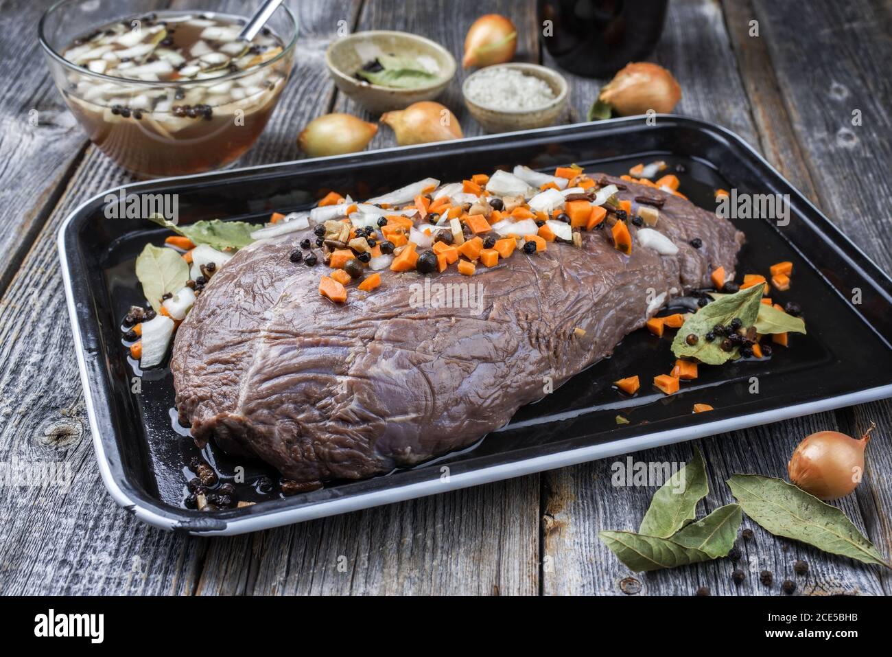 Marinated traditional German Sauerbraten from beef with vegetable and
