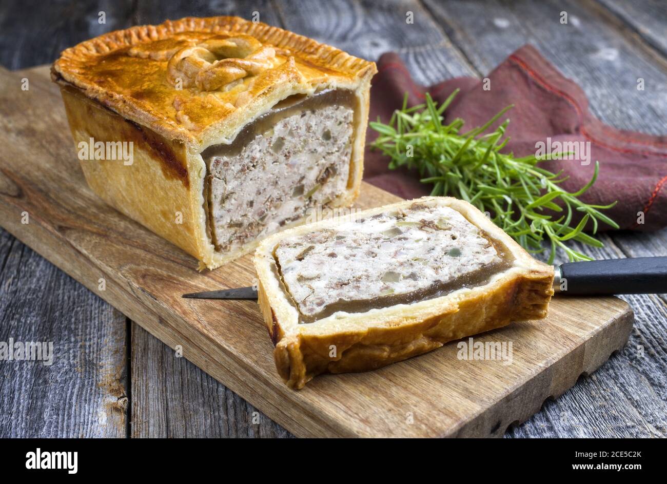 Traditional French Pate en croute with chicken offered as closeup on a