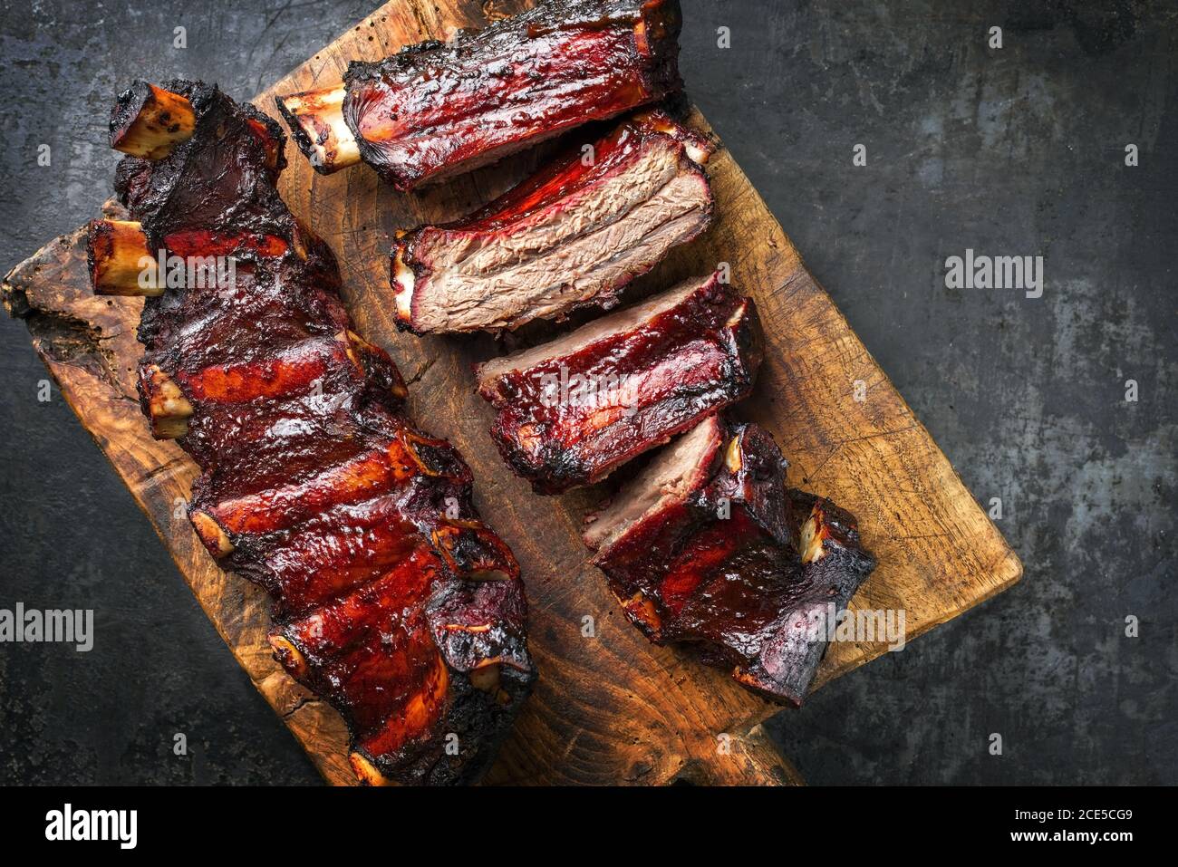 Barbecue chuck beef ribs with hot marinade as top on a wooden cutting board  with copy space right Stock Photo - Alamy