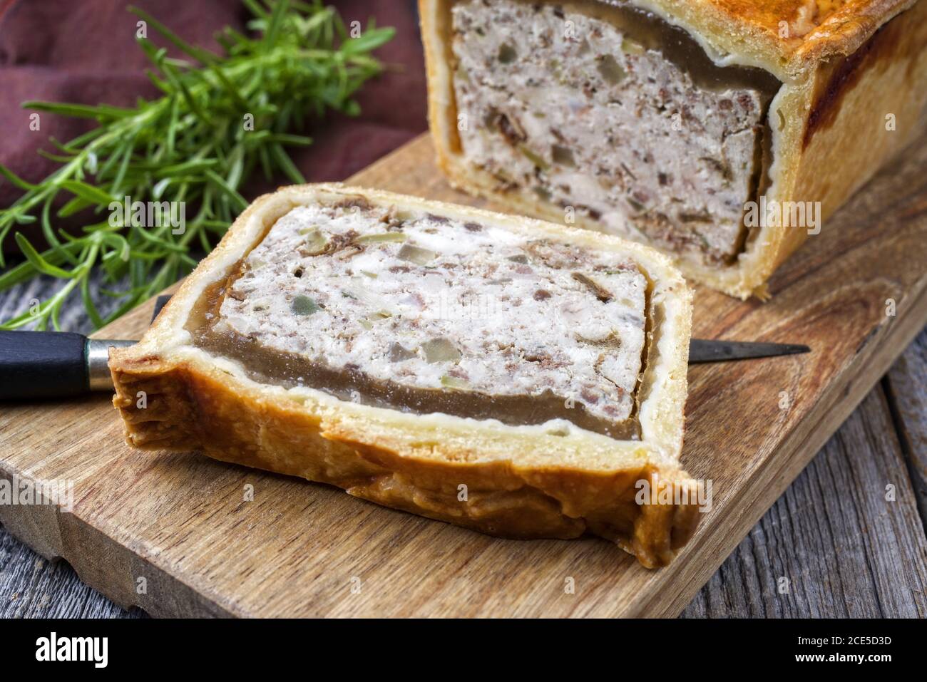 Traditional French Pate en croute with chicken offered as closeup on a