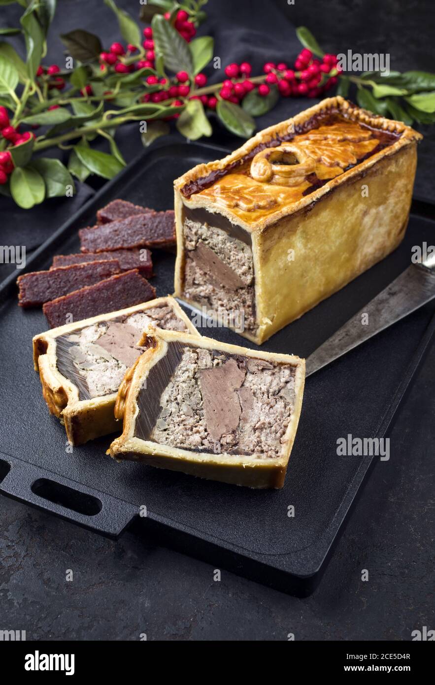 Traditional French Pate en croute with goose meat and liver offered