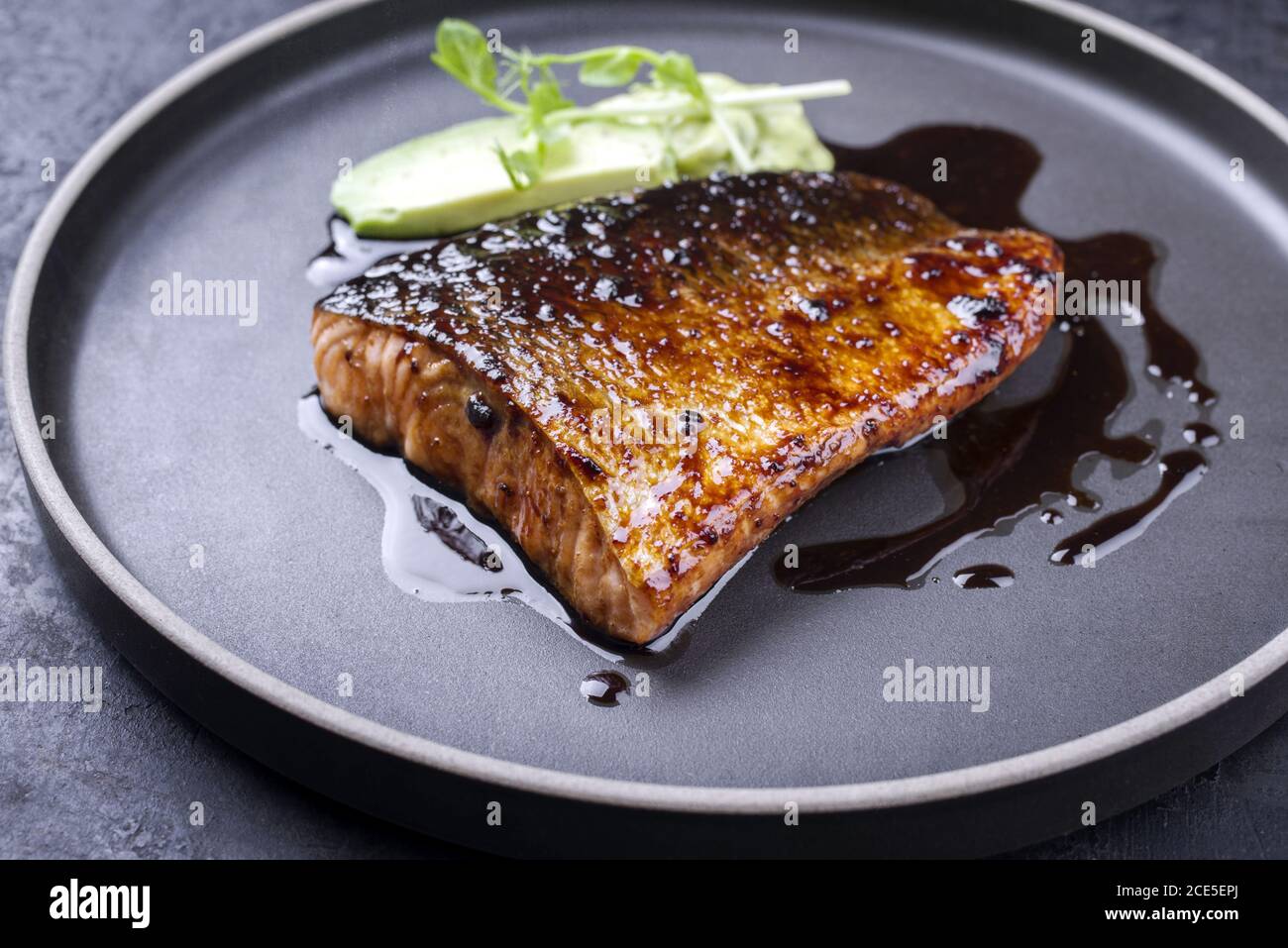 Minimalistic design Japanese salmon fish filet with avocado and wasabi