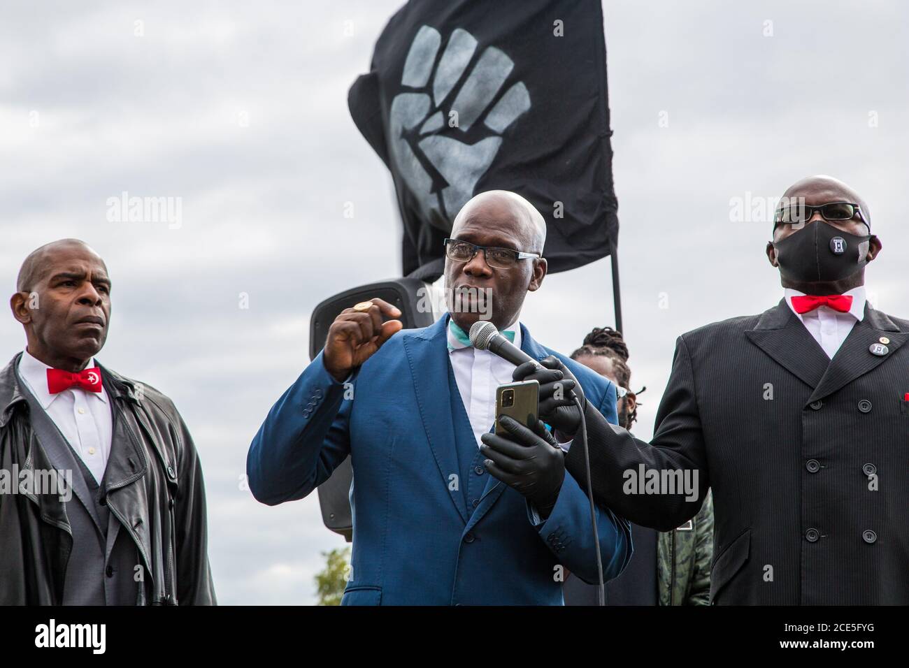 London, UK. 30th Aug, 2020. Leo Muhammad speaks during the demonstration.Organisers say the Million People march is intended to revive the original spirit of the carnival, which began as an attempt to resolve racial tensions in the capital. Credit: SOPA Images Limited/Alamy Live News Stock Photo