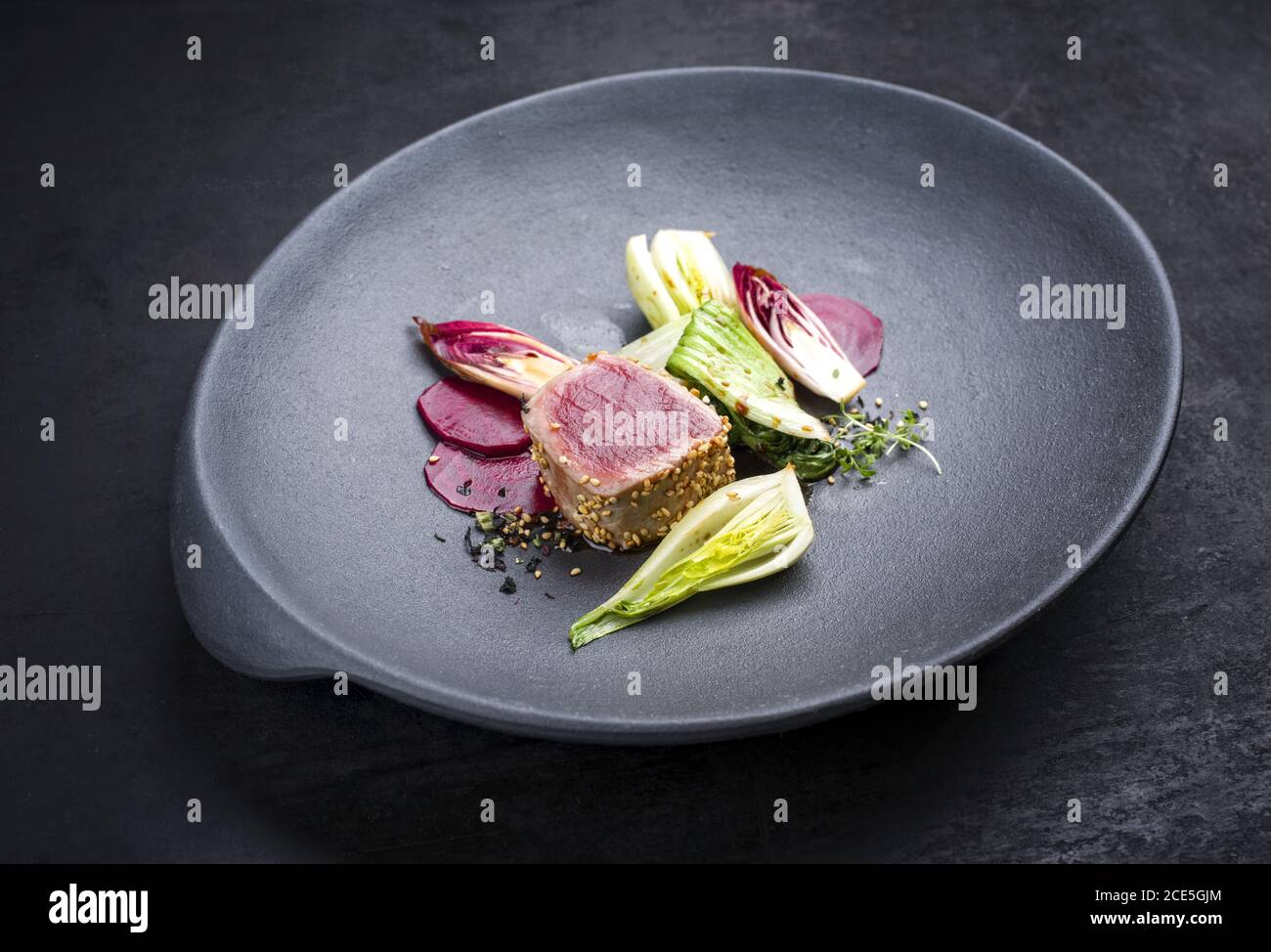 Japanese gourmet fried tuna fish steak tataki with pak choi Stock Photo Alamy