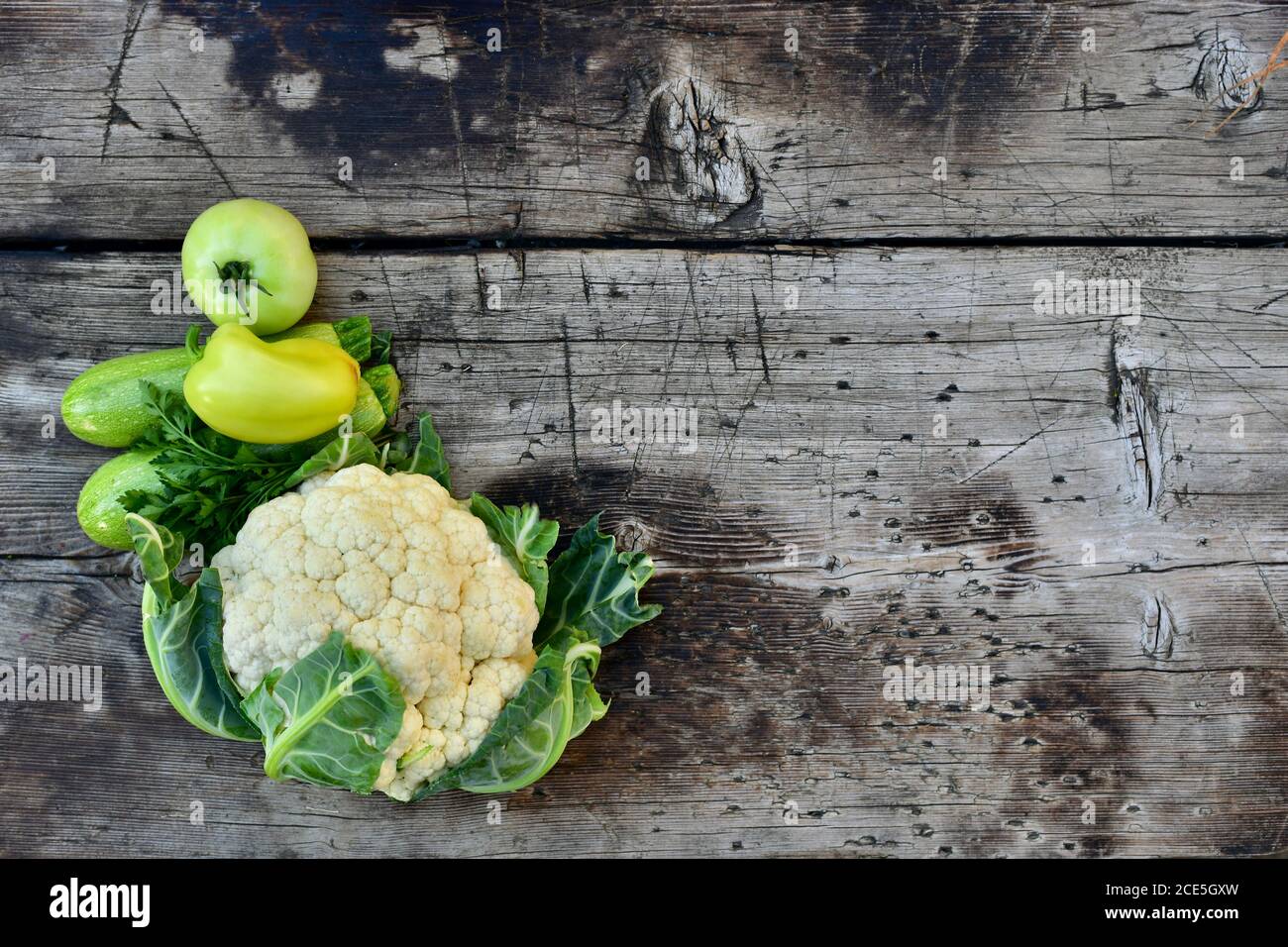 Single Courgette Green fresh whole vegetables, cauliflower head, two young courgettes ...