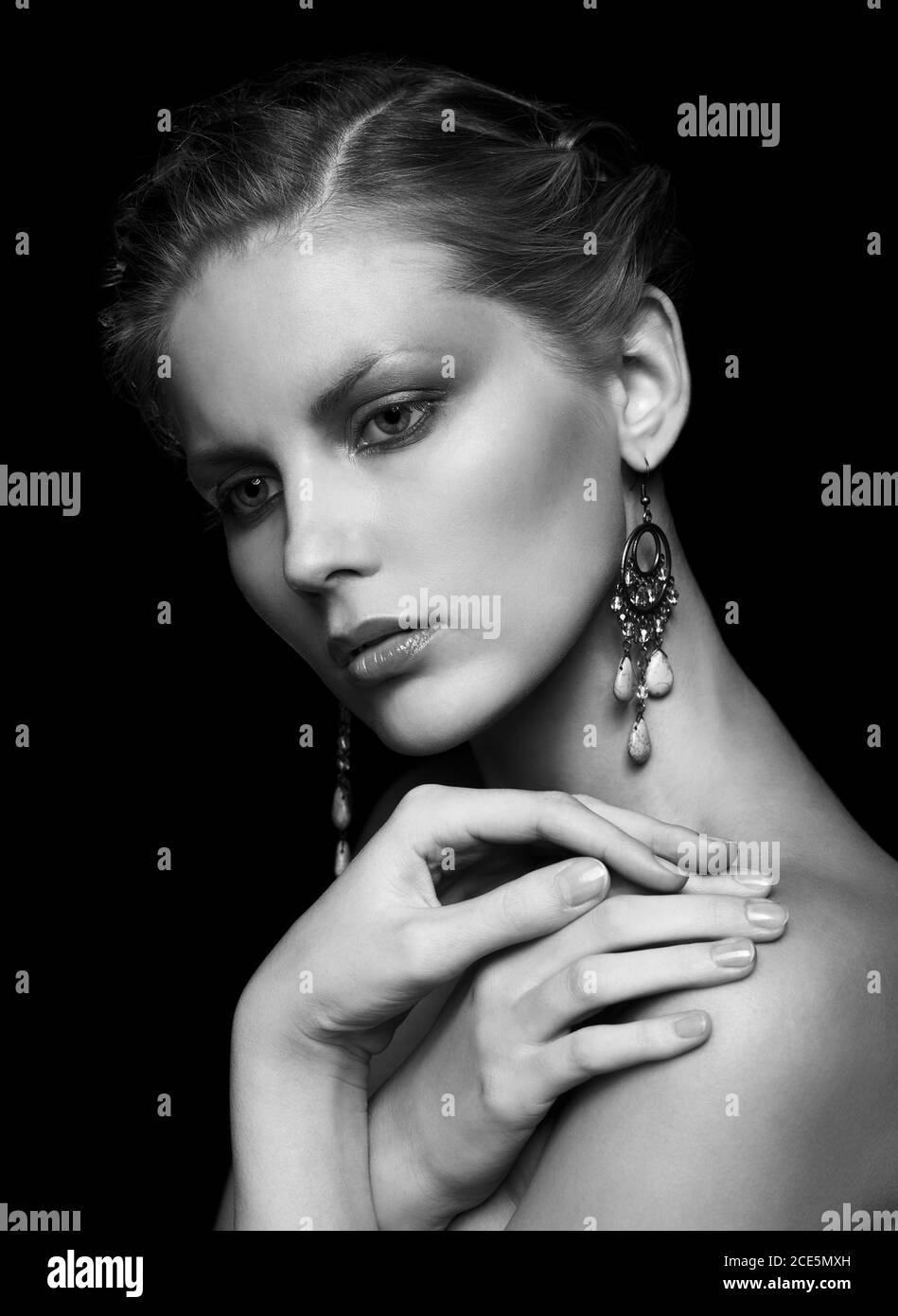Black and white portrait of young beautiful woman on black Stock Photo ...