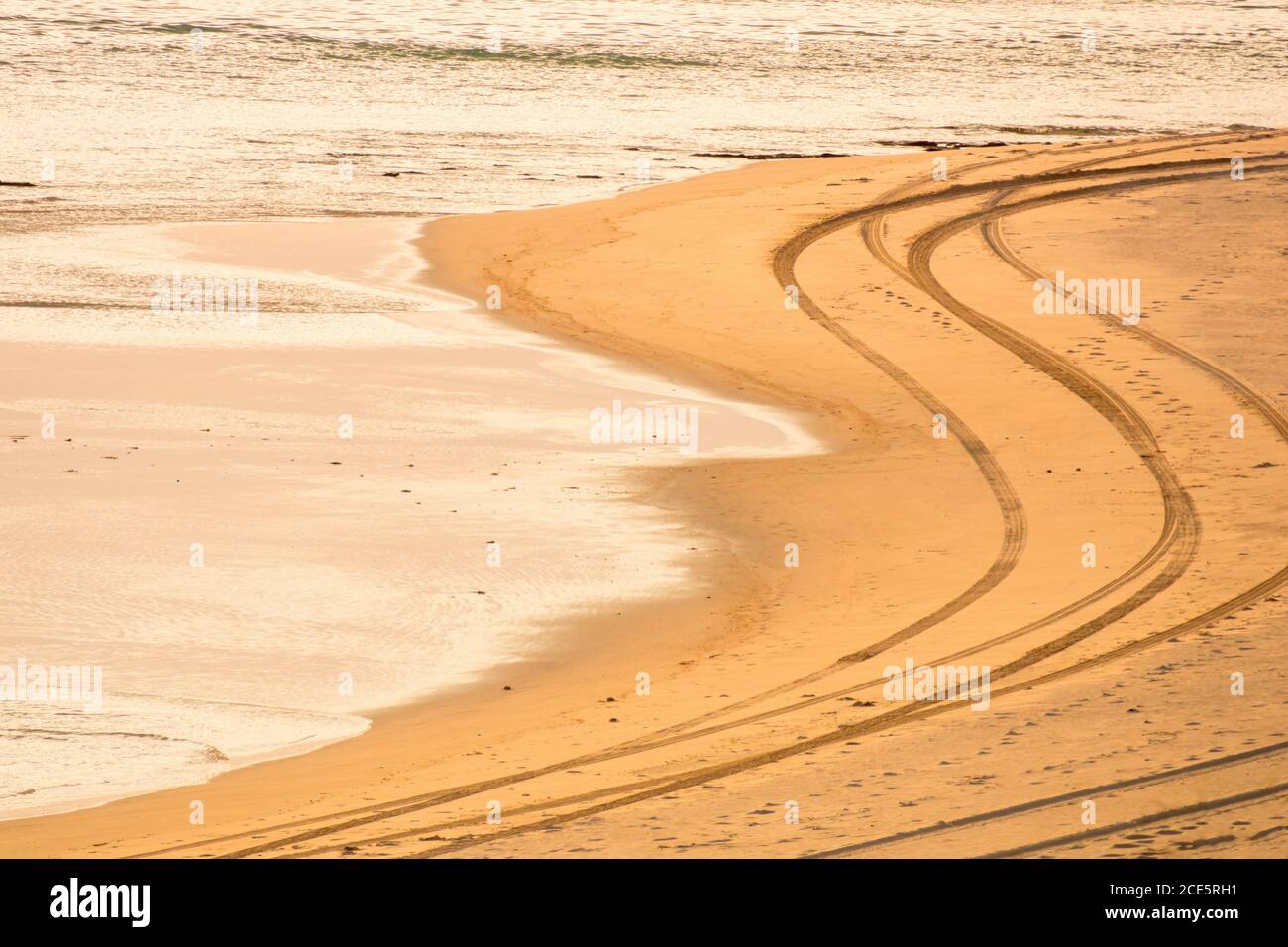Tire tracks on the beach Stock Photo