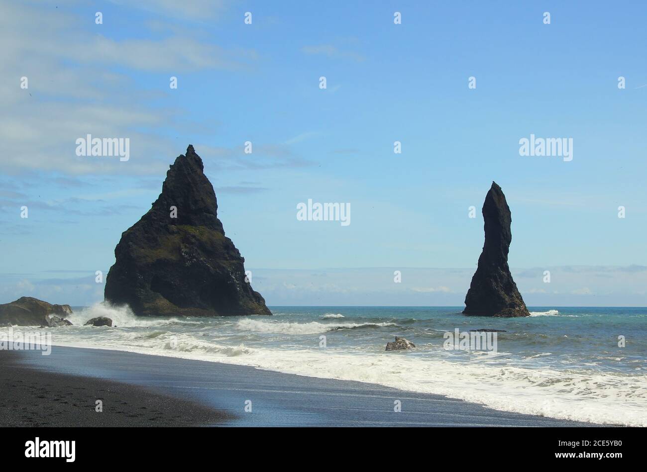 Exploring the black beach of Reinisfiyara Stock Photo