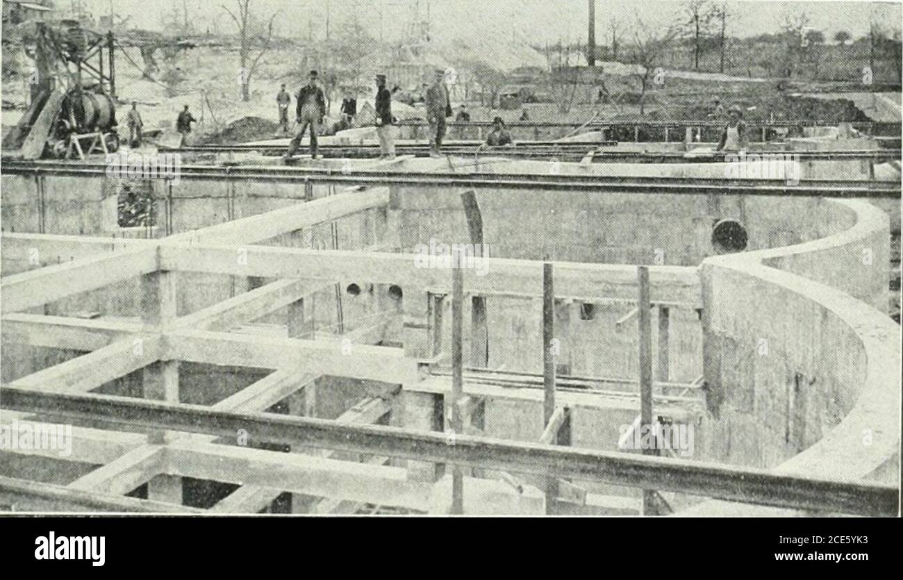 . Water & sewage works . ^mrrrT. SETTLING TANKS under constrvction, shoicing the ixinfurccd concrete streets, act-ing also as tie rods to take strains from the lobe-shaped ivalls. November, lOli 462 MUNICIPAL ENGINEERING manufactured by the Ham Baker Com-pany of London, England. They are de-signed to distribute the sewage upon thebeds with a loss of head not to exceed12 inches when the liquid is applied atthe maximum rate of 720 gallons persquare yard per day. Each distributer issupported on three rails, spaced 25 feeton centers. The length of the travel is200 feet. The effluent from the set Stock Photo