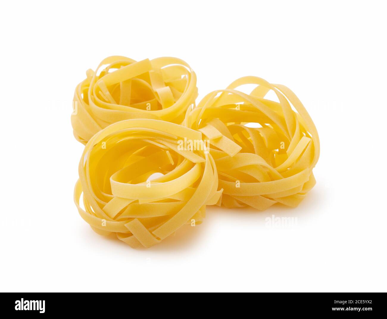 Shooting Tagliatelle placed on a white background from an angle Stock Photo