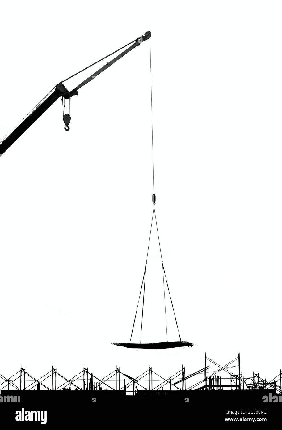 Outline image of a crane lowering a metal plate onto a construction site Stock Photo