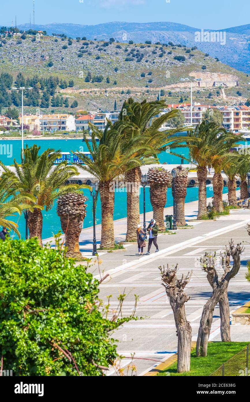 Promenade with palm trees in Nafplio, Greece Stock Photo