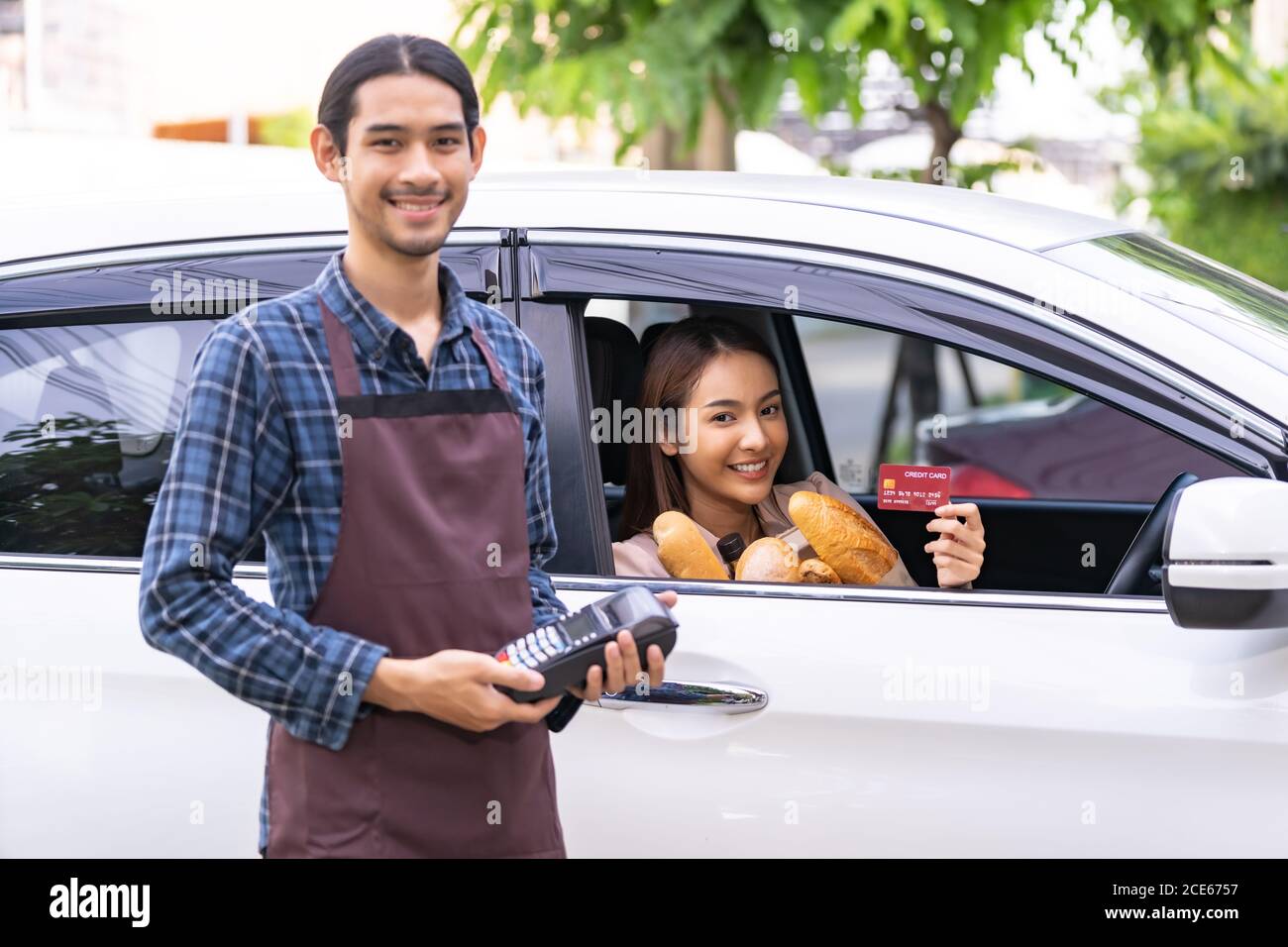 asian woman making contactless payment for grocery Stock Photo