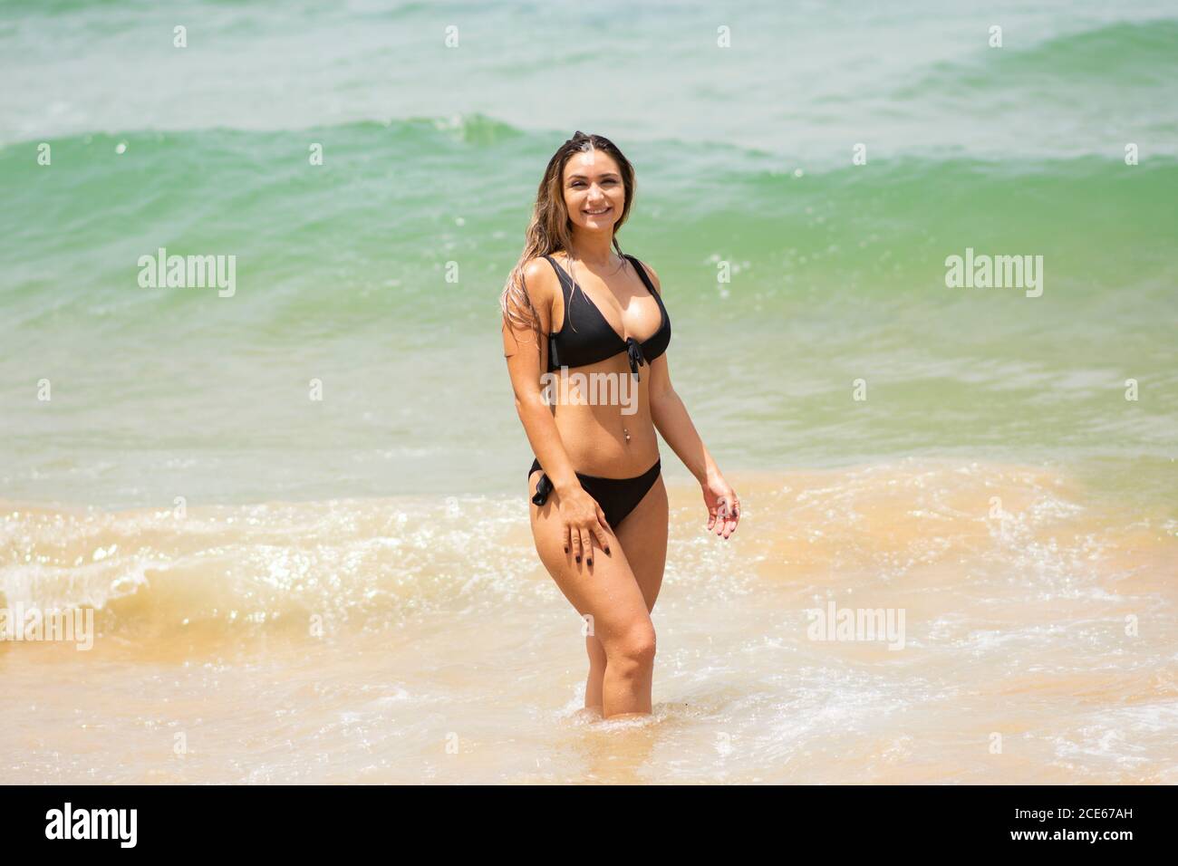 Beautiful woman in bikini smiling Stock Photo