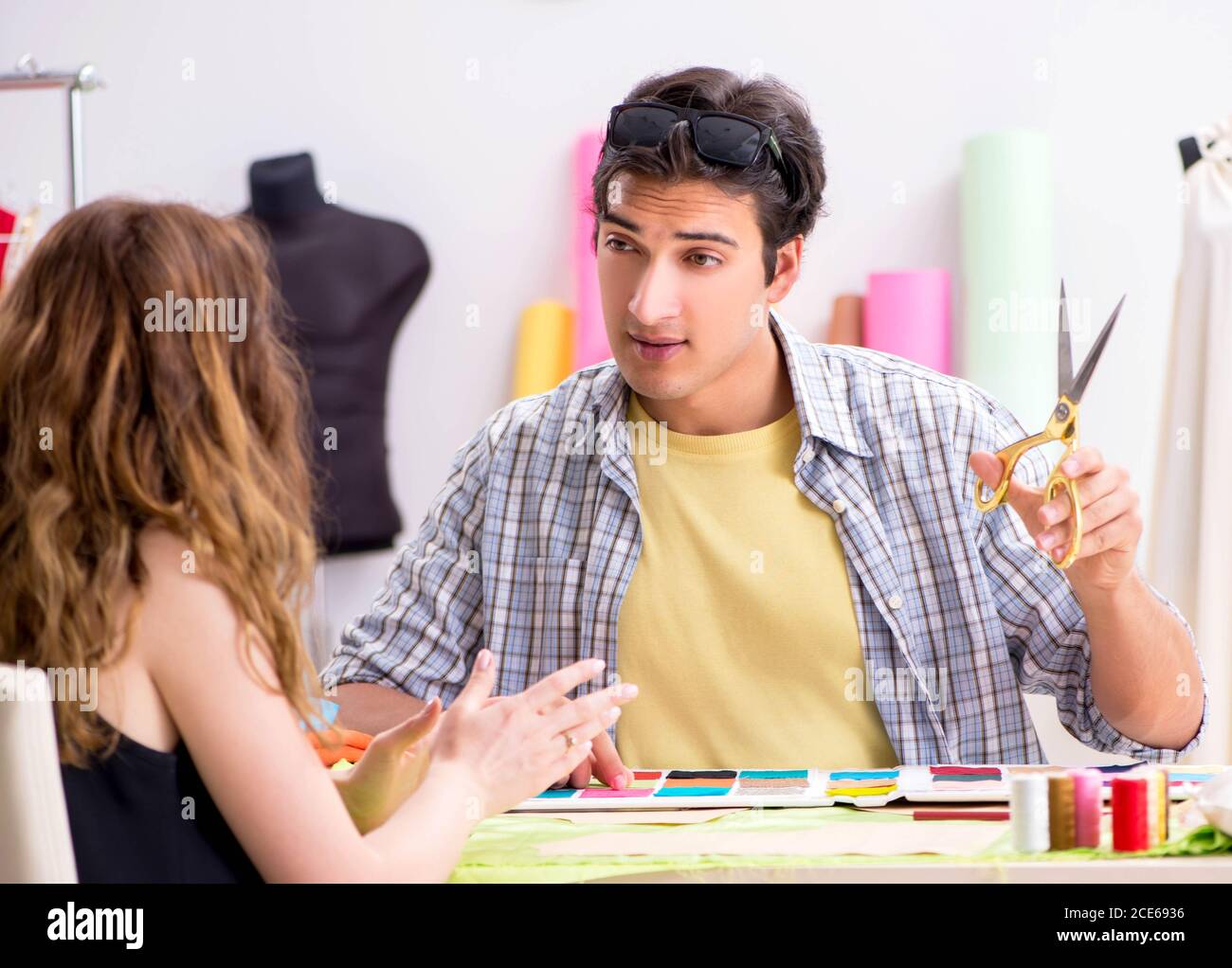 The young tailor working in his workshop Stock Photo - Alamy