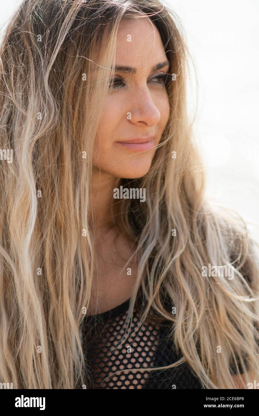 Beautiful woman looking away on the beach Stock Photo