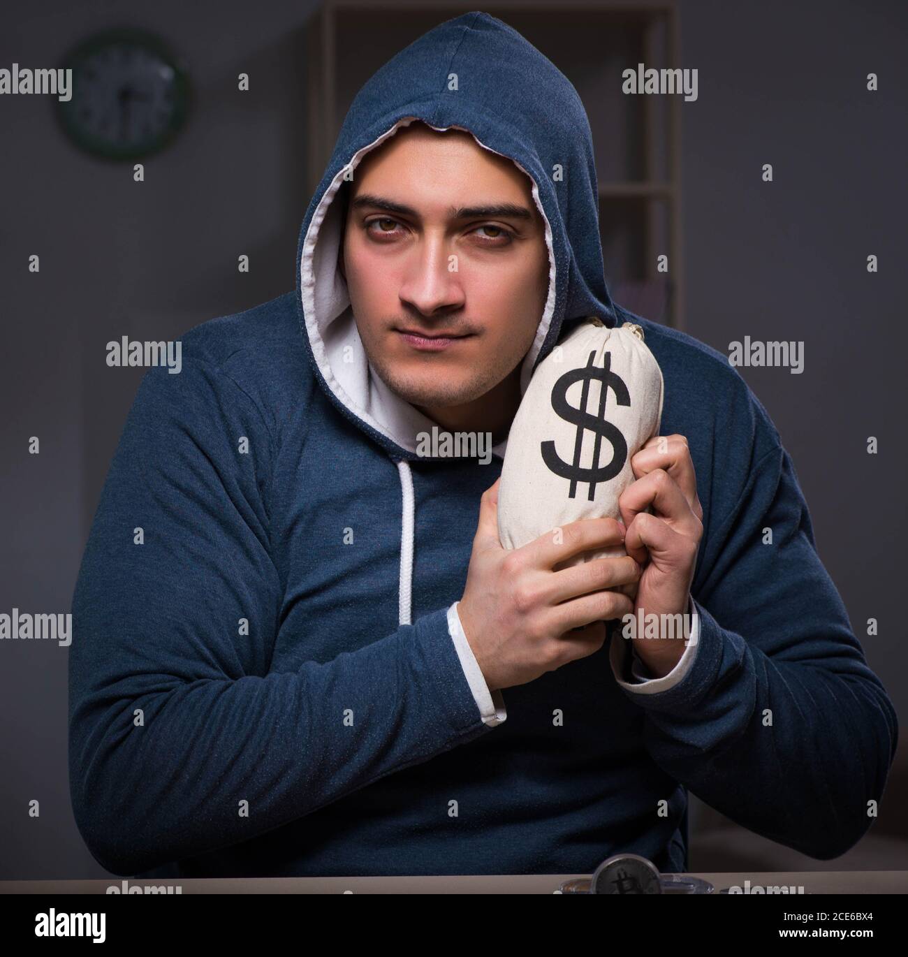 The hacker with sack of money Stock Photo - Alamy