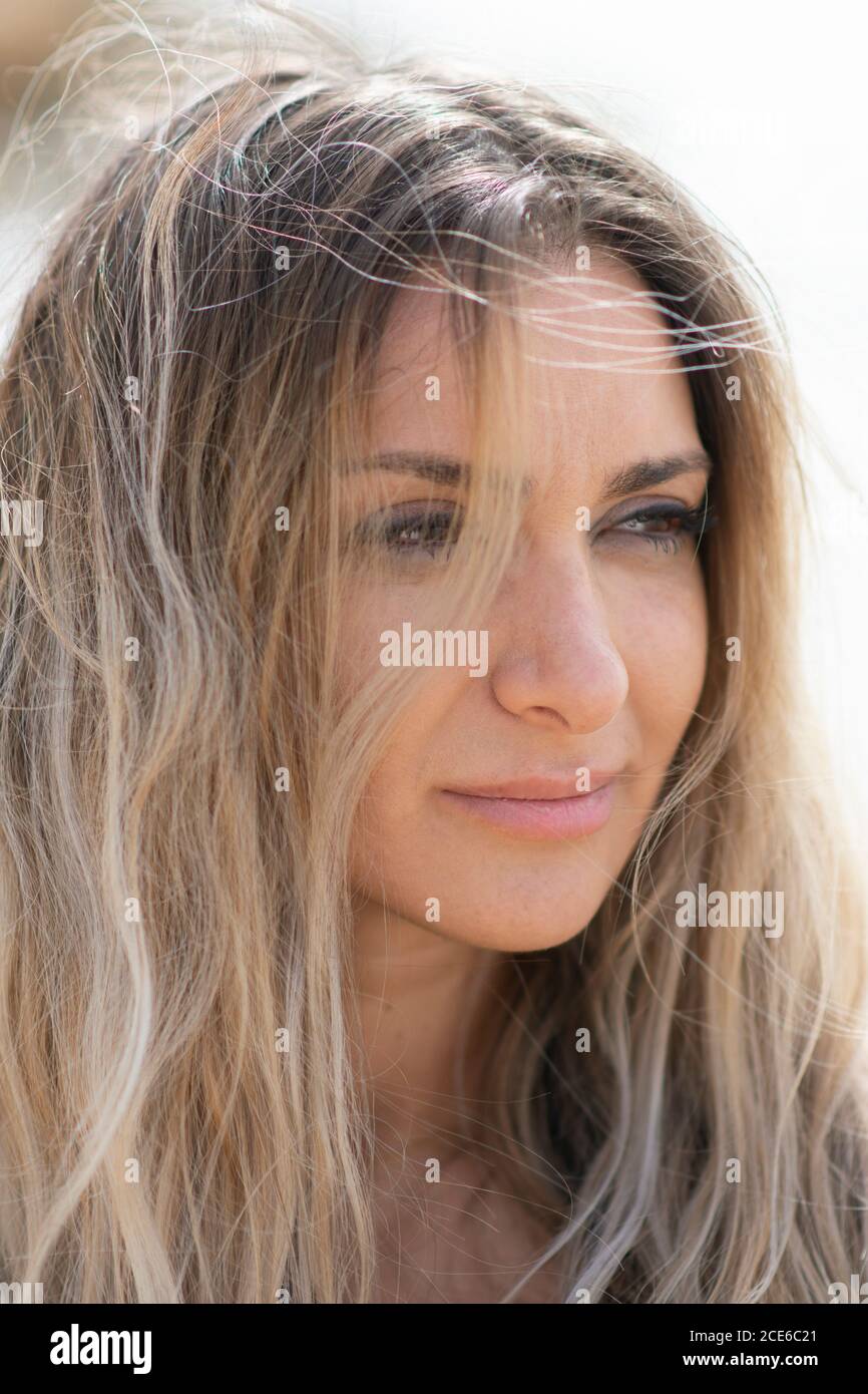 Beautiful woman looking away on the beach Stock Photo