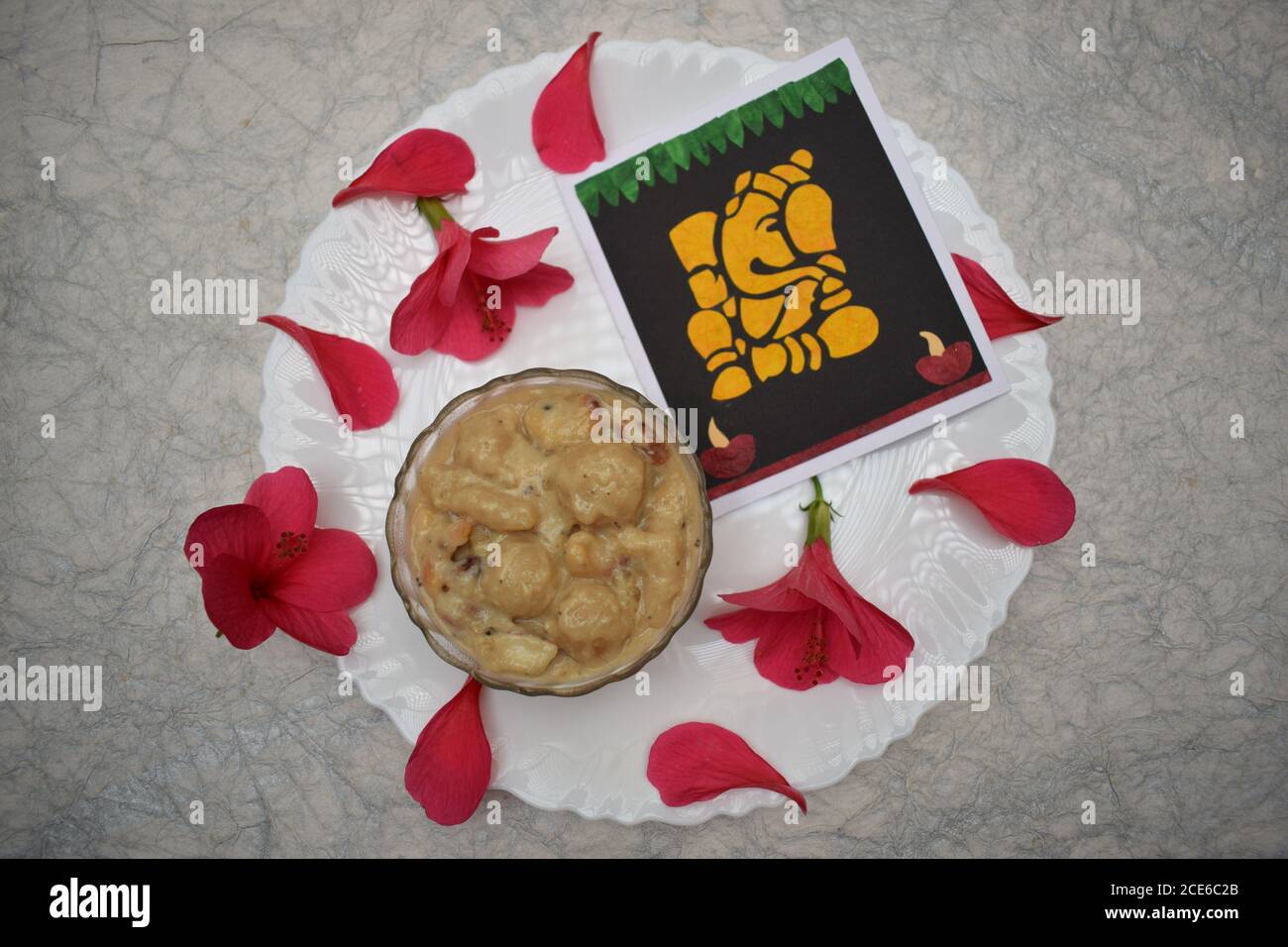 Undralla payasam sweet indian dish offered on Ganesh chaturthi festival in telangana and andhrapradesh south india. Decorated with flowers and petals Stock Photo