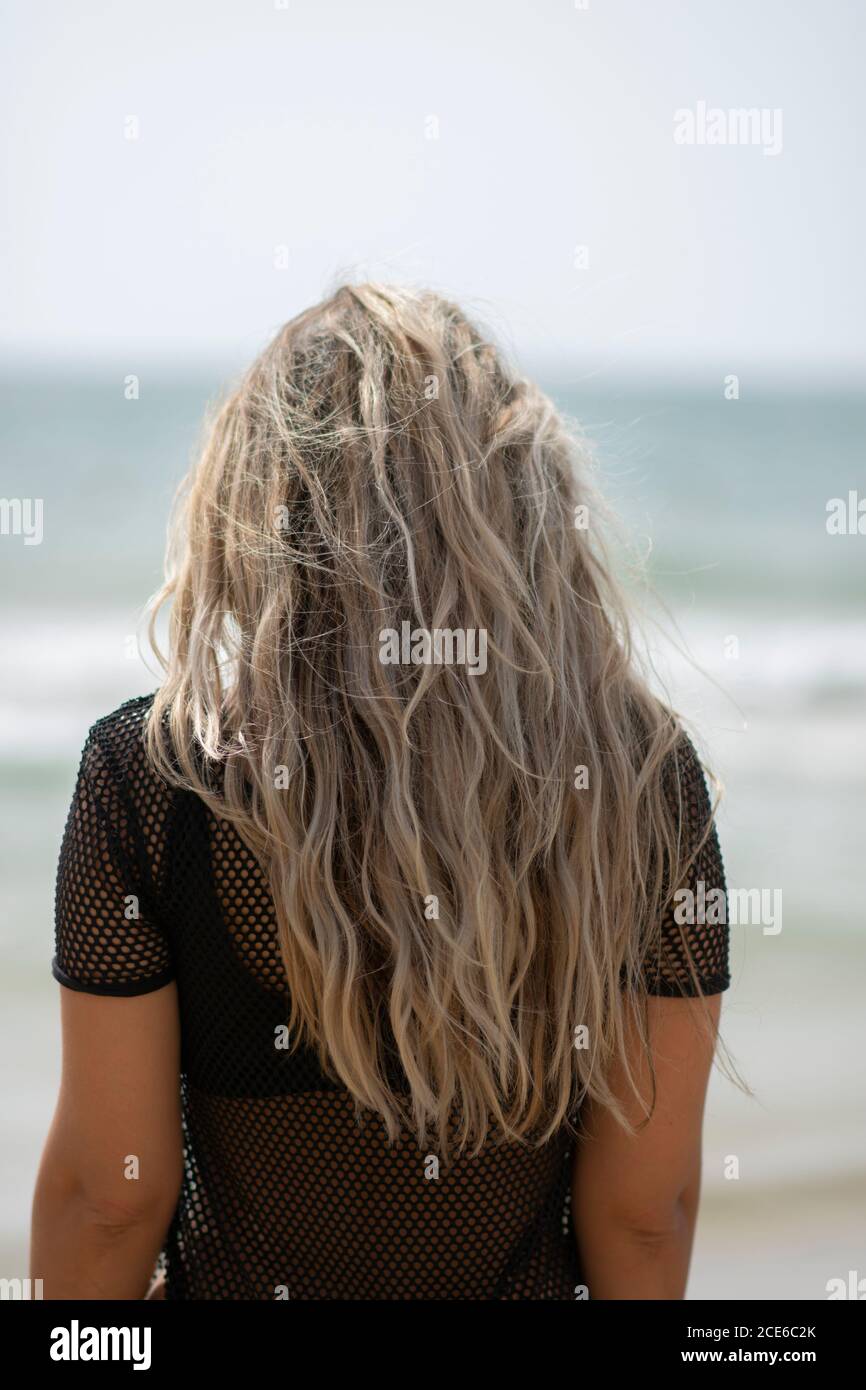 Back Rear Female Rear End Rear view woman on the beach Stock Photo - Alamy