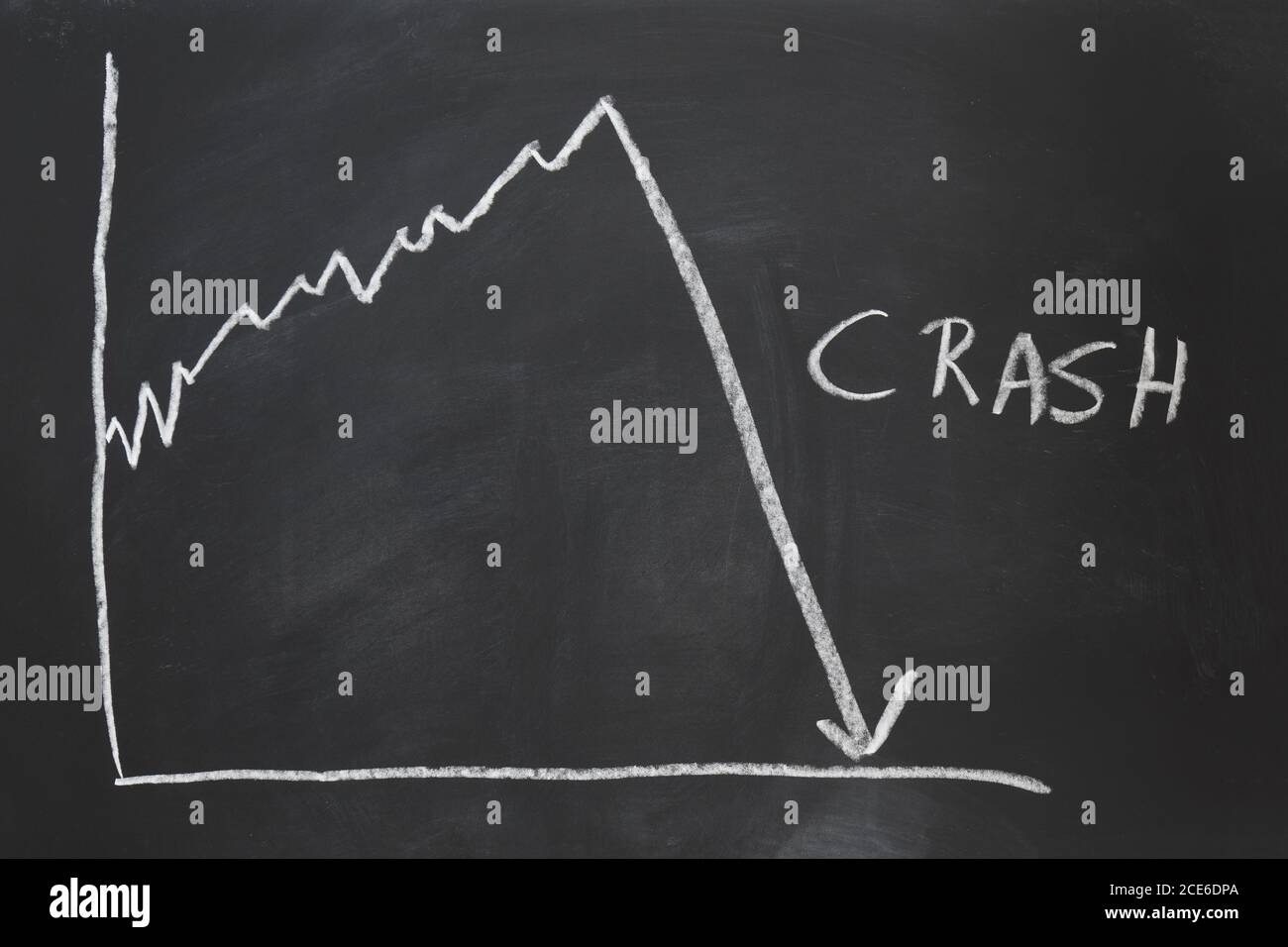 stock market crash economy crisis handdrawn graph on chalkboard