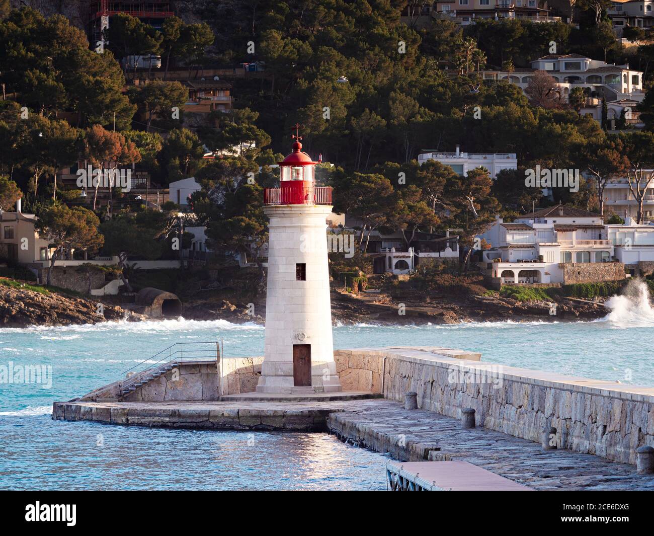 Lighthouse on mole. Port d'Andratx harbor Stock Photo