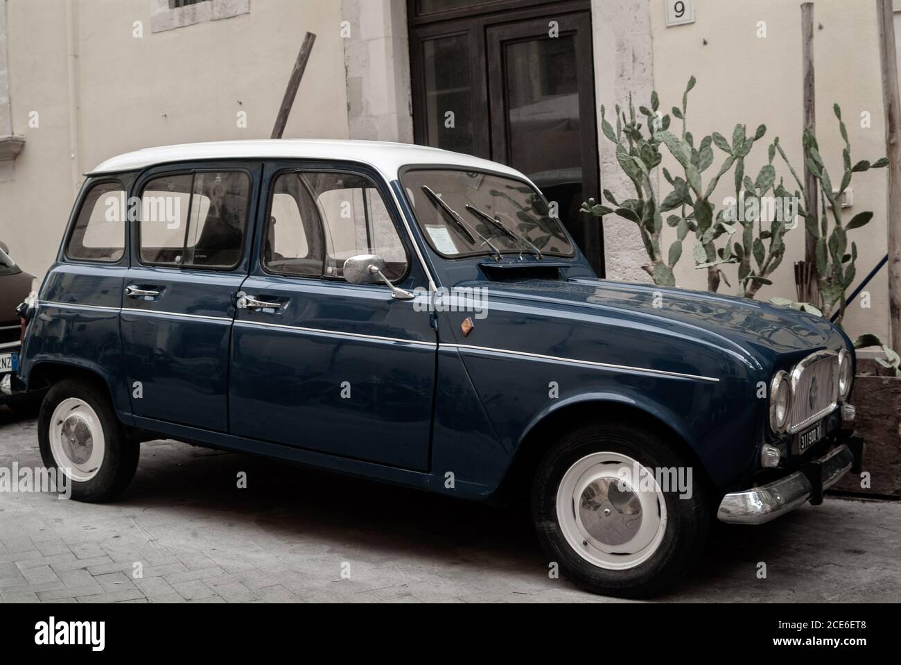 Classic blue Renault 4 parked. Ortigia urban area. Syracuse Siracusa, Sicily Italy, summer season Stock Photo