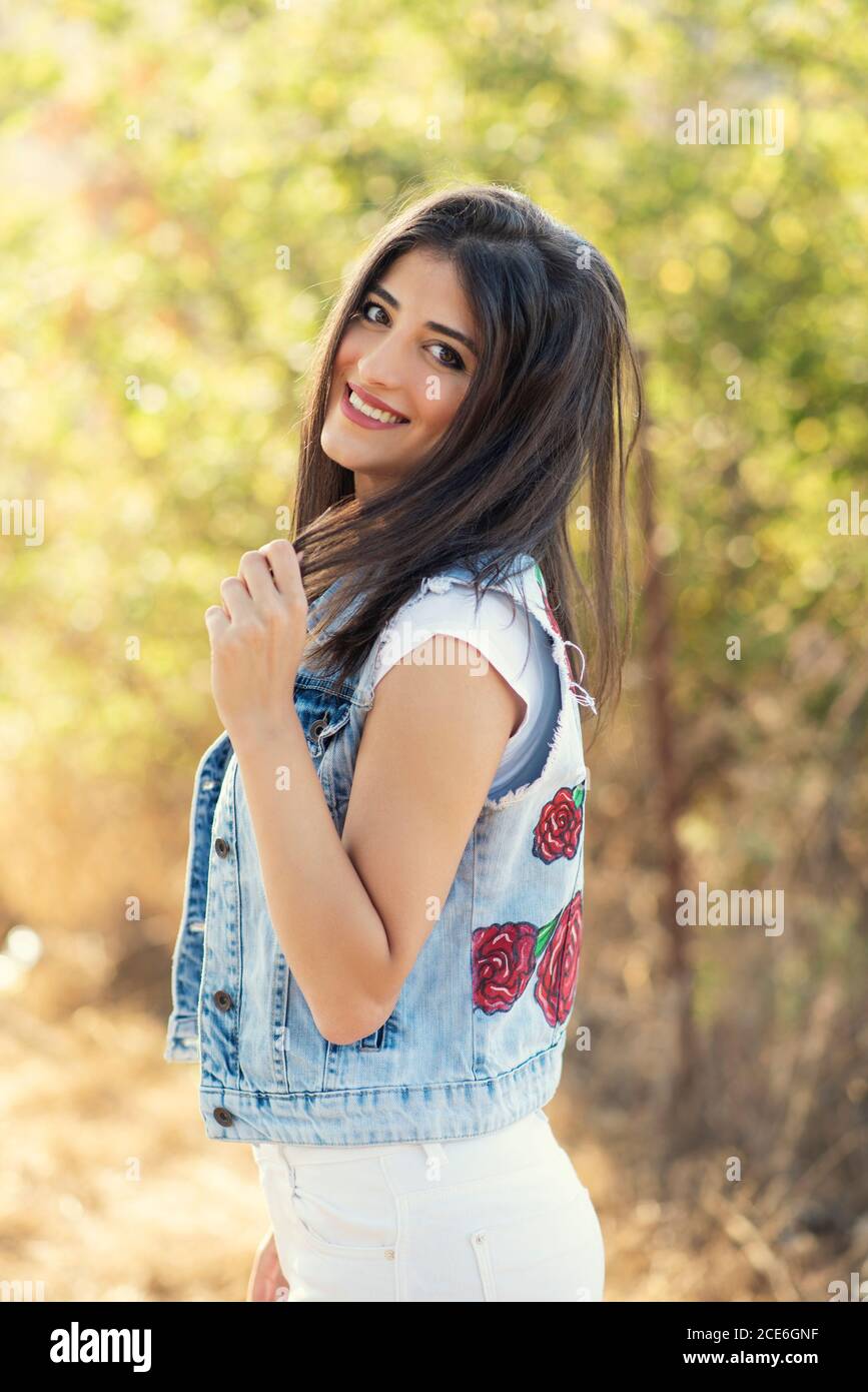 Beautiful young woman smiling outdoors Stock Photo