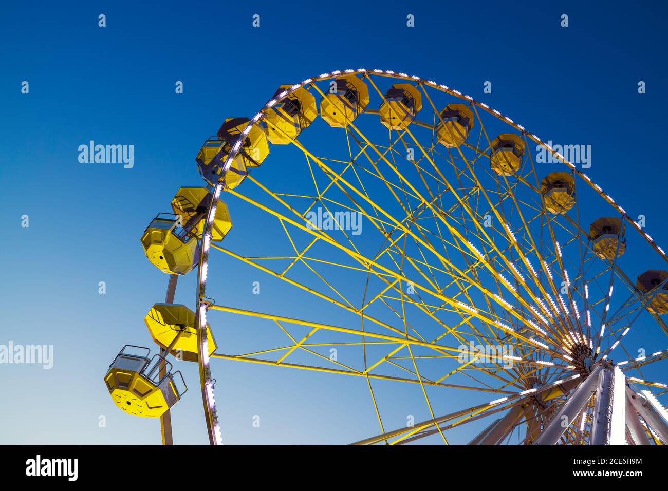 Ferris Wheel with sunset blue sky and clouds Stock Photo - Alamy