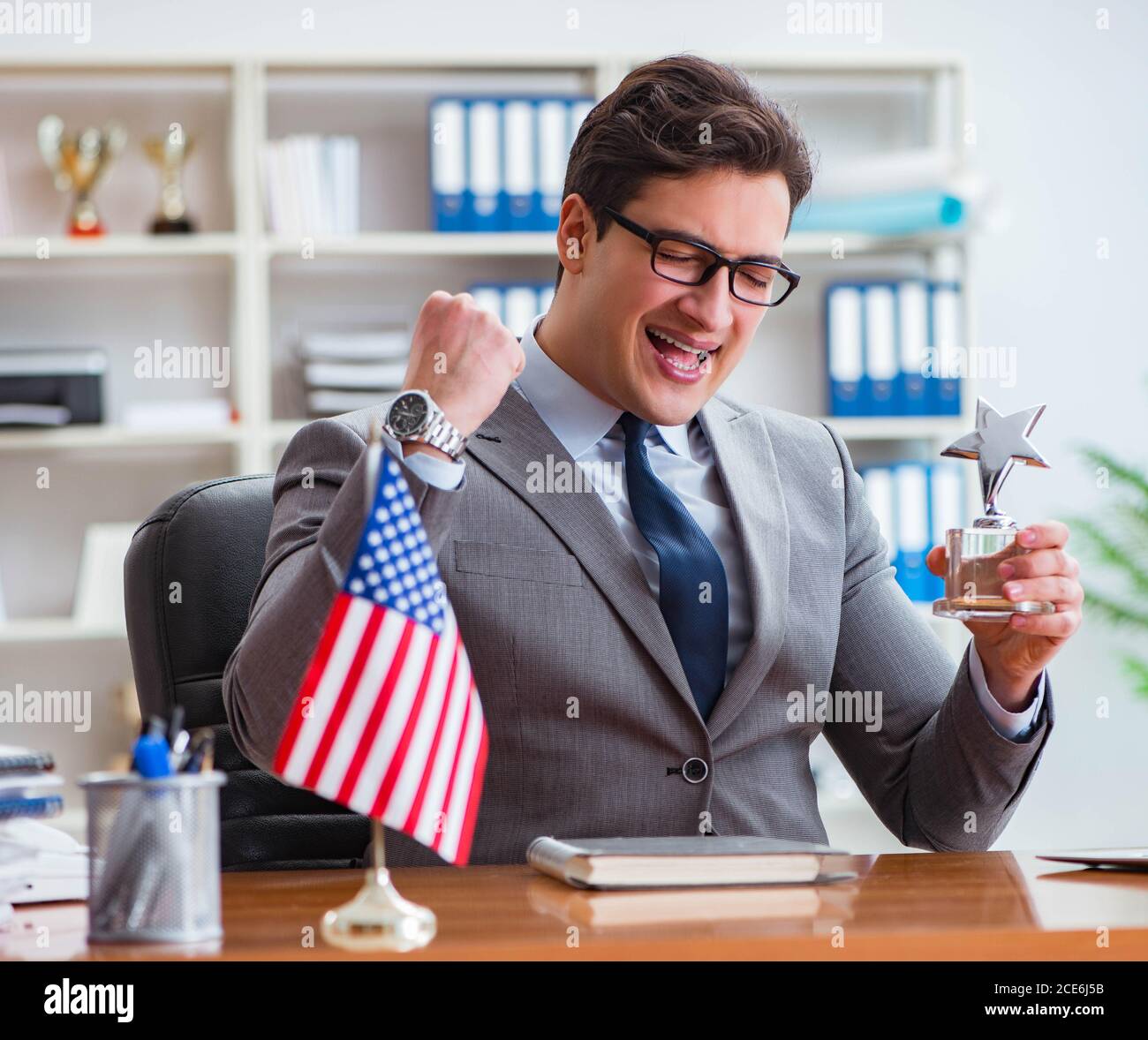 The businessman with american flag in office Stock Photo - Alamy