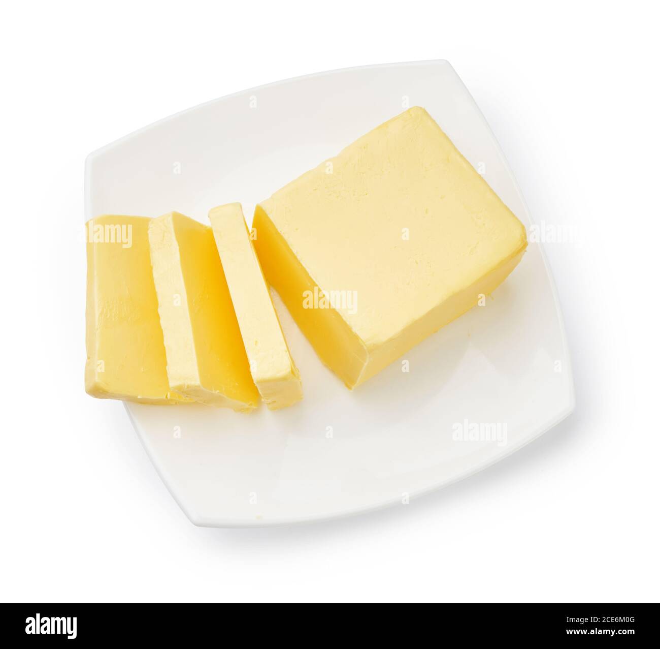 Sliced butter of piece butter on white plate isolated. Top view Stock