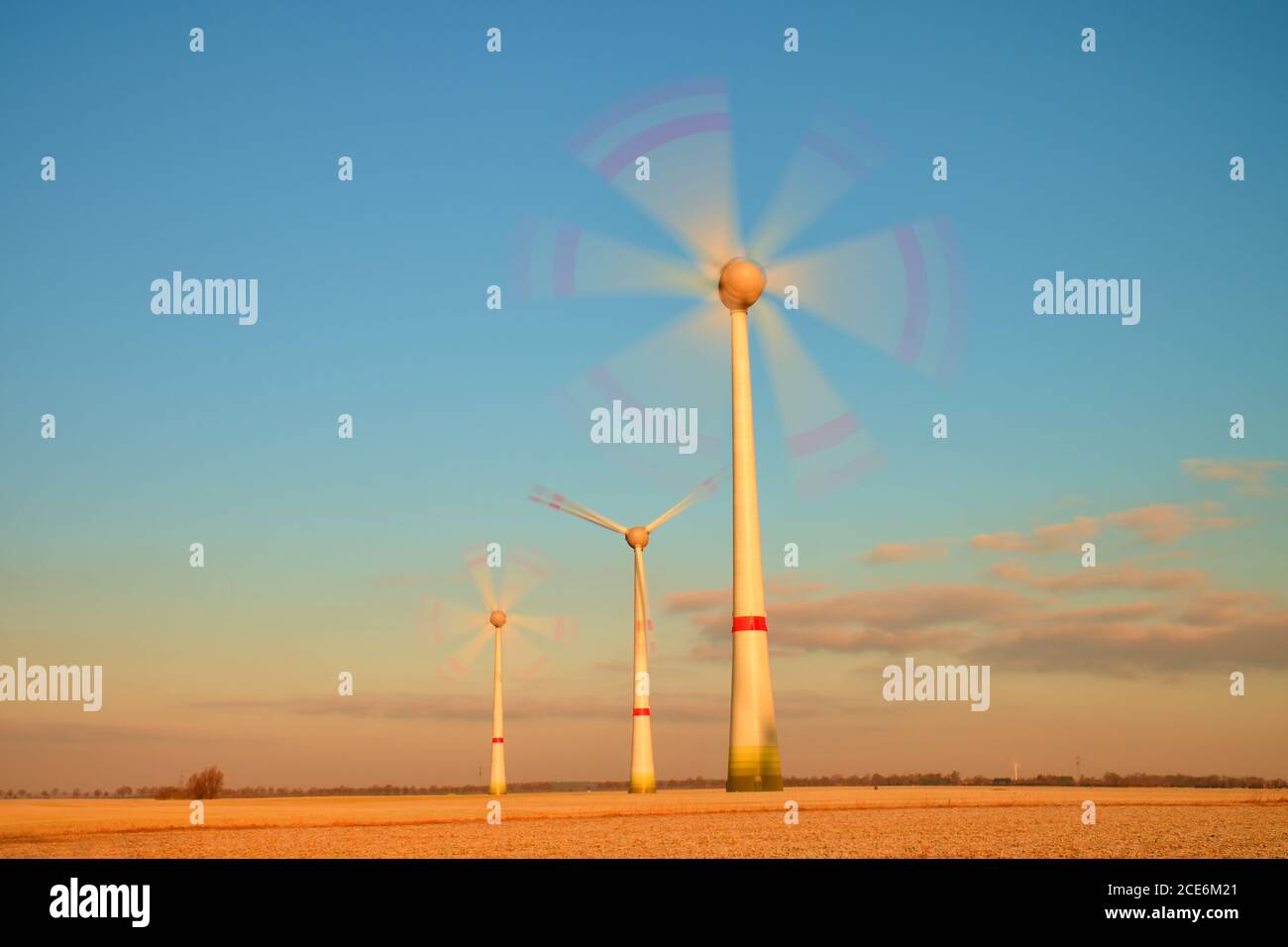 Modern Wind Turbines Producing Energy in sunny spring morning. Vintage Style Toned effect Stock Photo