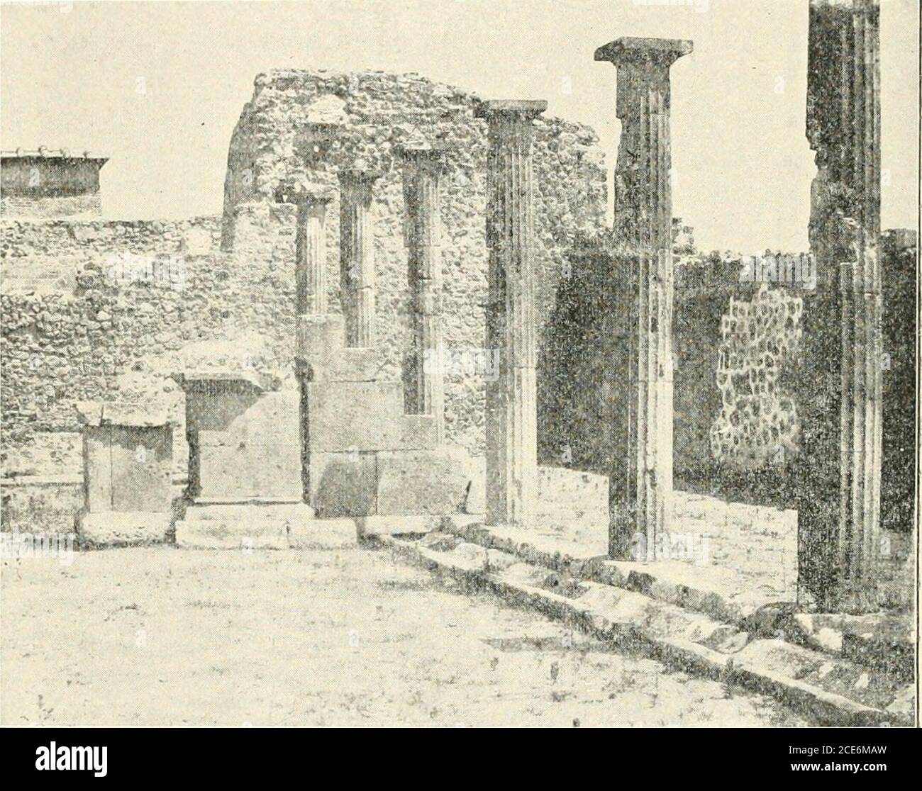 . Pompeii : its life and art . ius Adiranus had left by will tothe Pompeian youth. The translation of the word vereiiai, tothe youth, otherwise doubtful, is confirmed by various factswhich indicate that the building was intended as a smallpalaestra or open-air gymnasium for boys. While the Palaestra had its original length, the entrance,which is now nearer the east end, was at the middle of thenorth side. Opposite it, near the colonnade on the south side,is a pedestal of tufa, before which stands a small table of the 159 i6o POMPKII same stone (Fig. 71). The pedestal is reached by narrow-steps Stock Photo