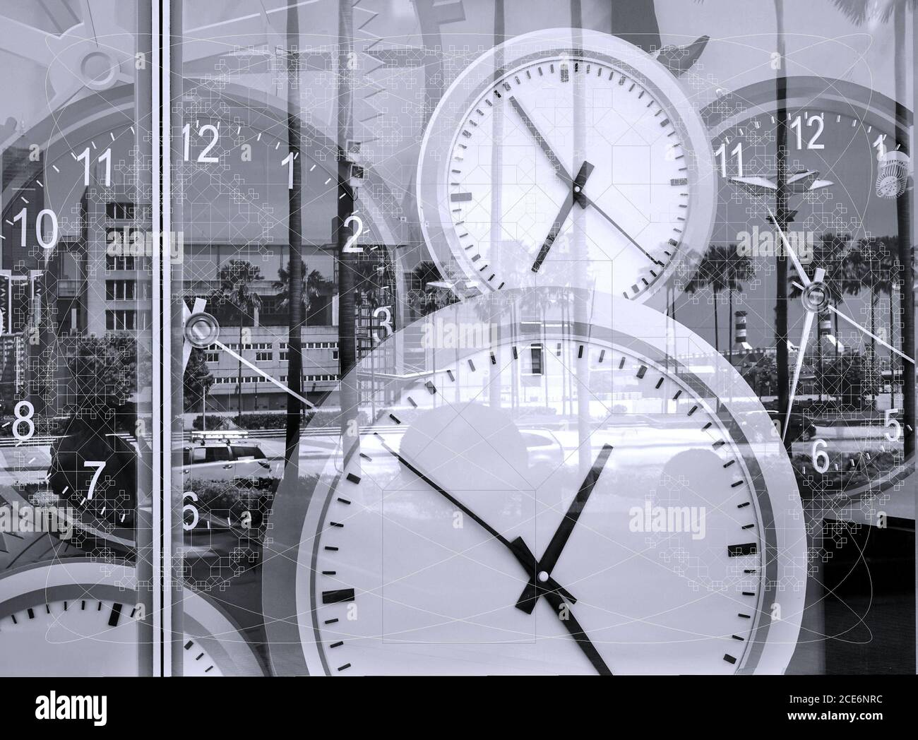 Large clocks reflecting in shop window illustrate the concept of time