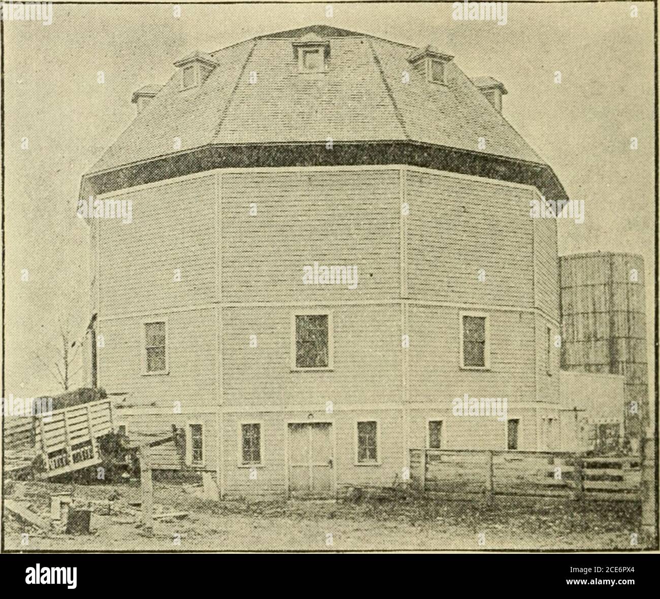 Barn plans and outbuildings . Fig. 86—INSIDE AN ILLINOIS DAIRY BARN two  upper stories twenty-four feet. The studding is ofpine two by six inches,  joists two by eight, beams andposts two