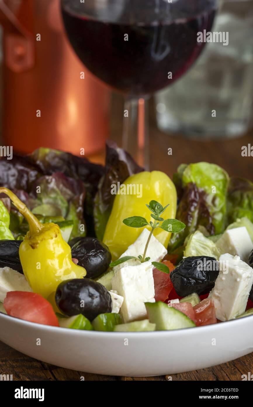 Greek salad with red wine Stock Photo Alamy