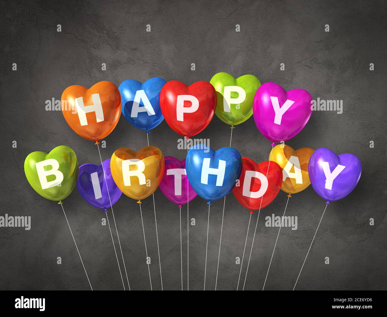 Colorful happy birthday heart shape air balloons on a concrete ...