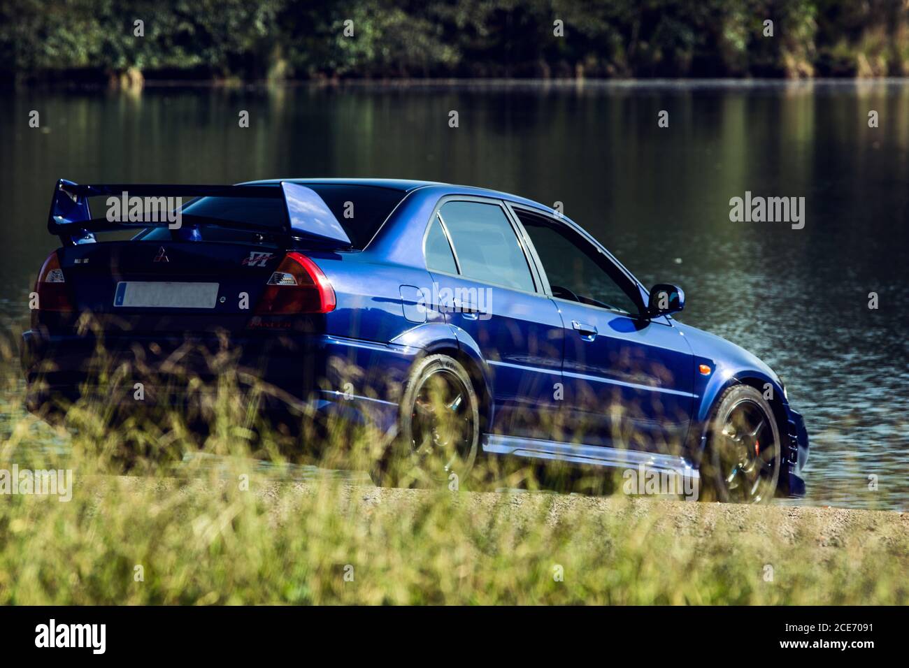 Mitsubishi Lancer Evolution 7 Ralliart Limited Edition, shot in a natural park surrounded by nature Stock Photo