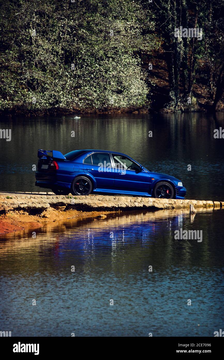 Mitsubishi Lancer Evolution 7 Ralliart Limited Edition, shot in a natural park surrounded by nature Stock Photo