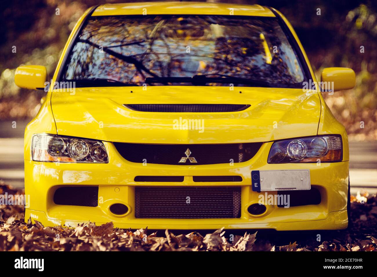 Mitsubishi Lancer Evolution 9 Shot In A Mountain Road Full Of Autumn Leaves Stock Photo Alamy