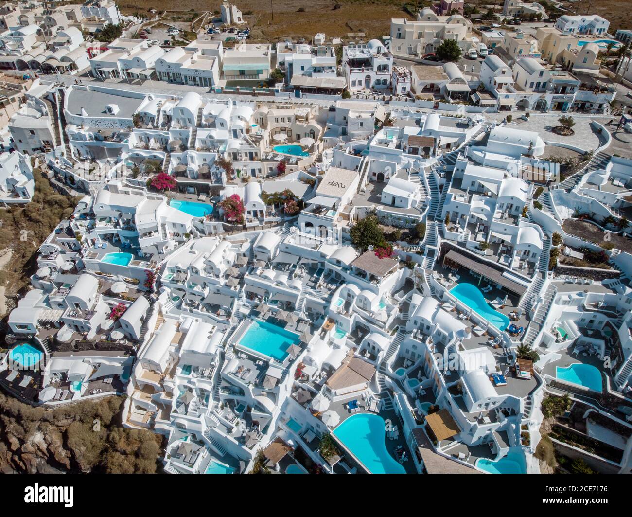 Goma inventar guerra Drone view over Santorini, aerial view over the whitewashed village of Oia  with luxury vacation resort with infinity pools in Santorini Greece Stock  Photo - Alamy