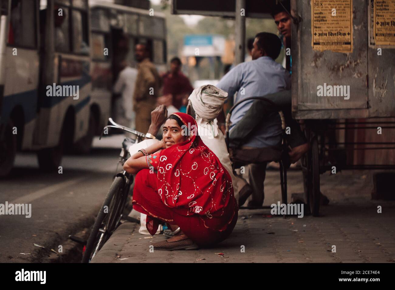 Woman waiting for bus in sari hi-res stock photography and images - Alamy